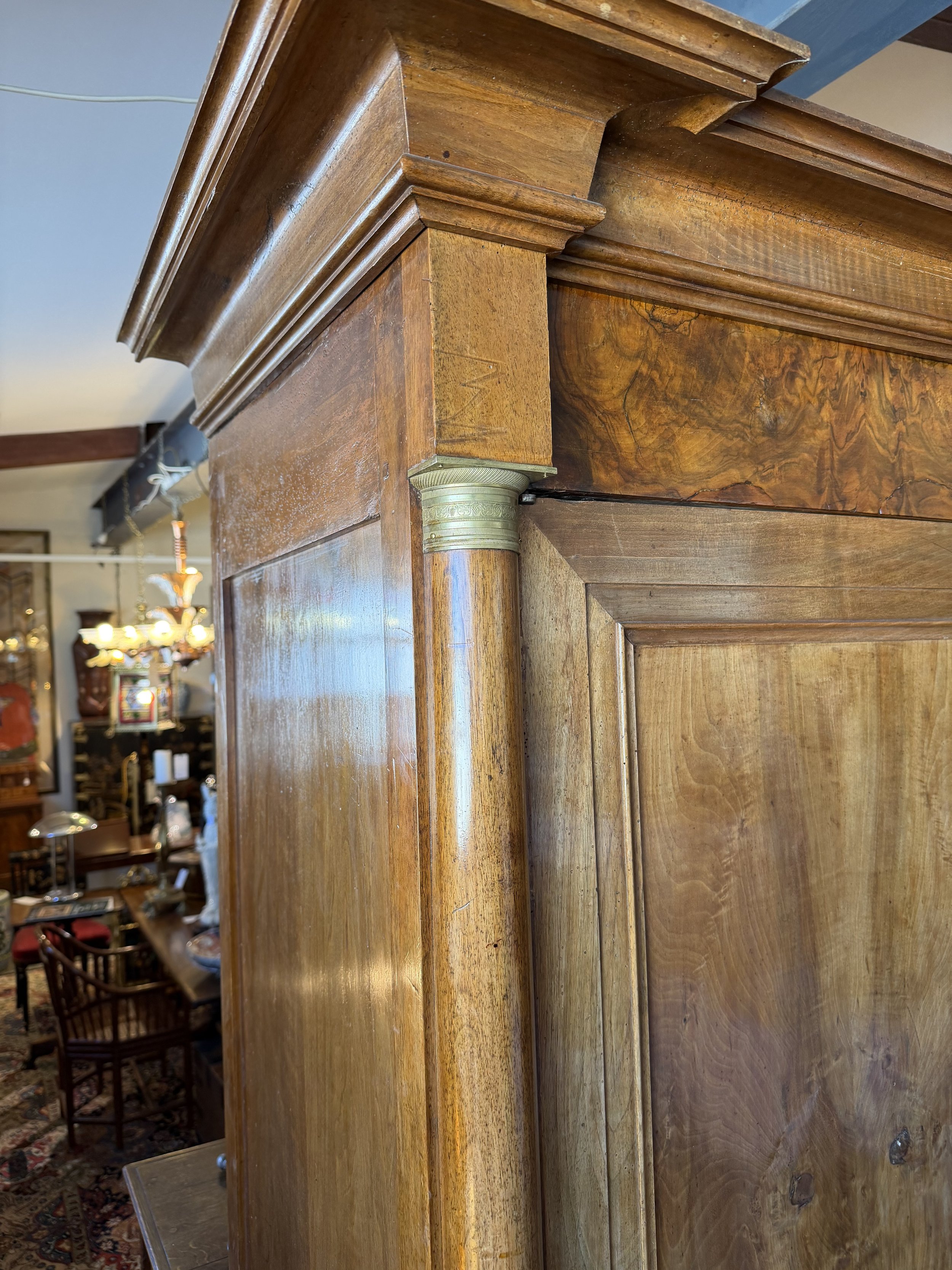 This is a picture of a fabulous French Empire walnut cupboard c1830 with the most beautiful colour and original hardware.