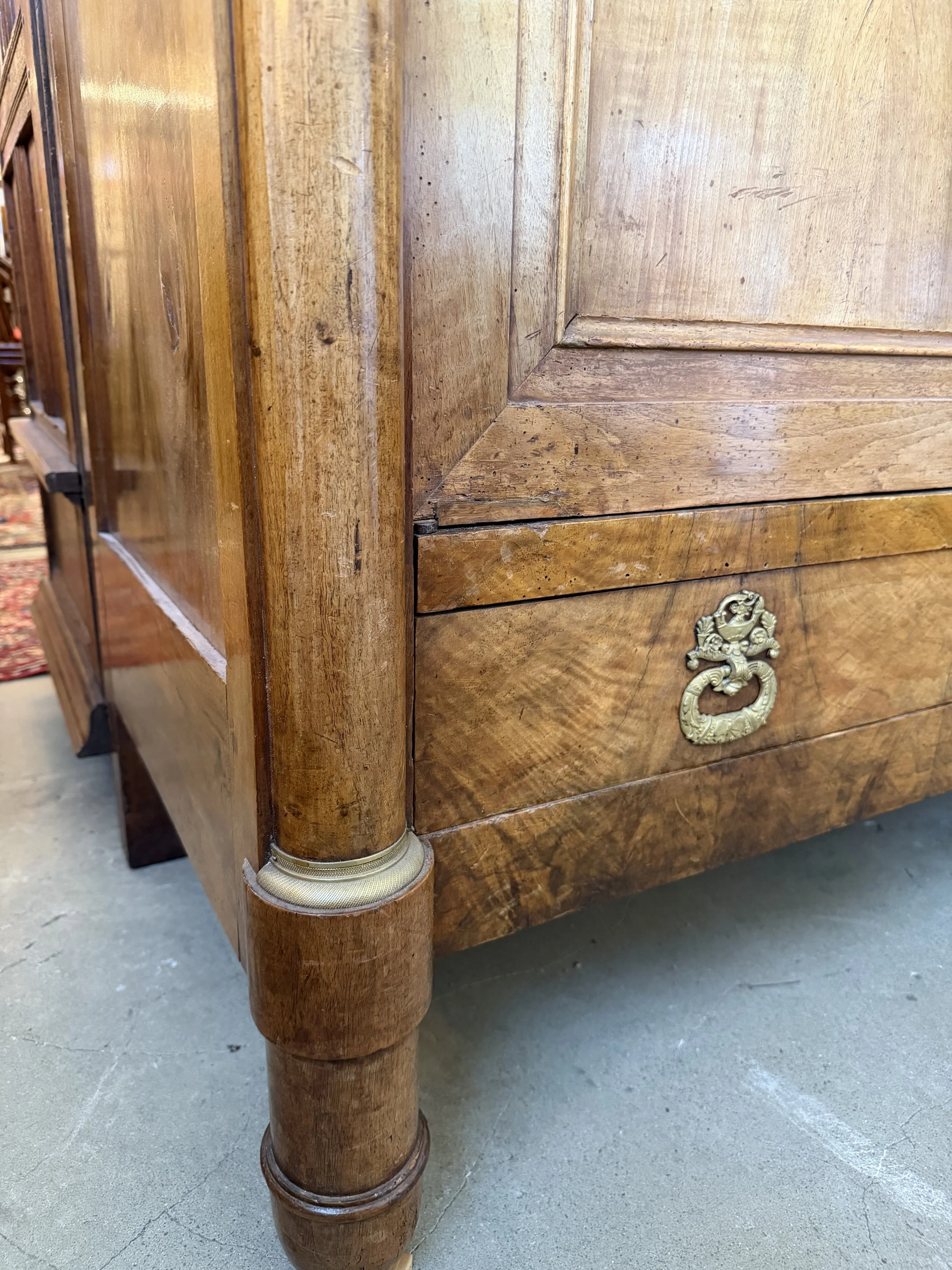This is a picture of a fabulous French Empire walnut cupboard c1830 with the most beautiful colour and original hardware.