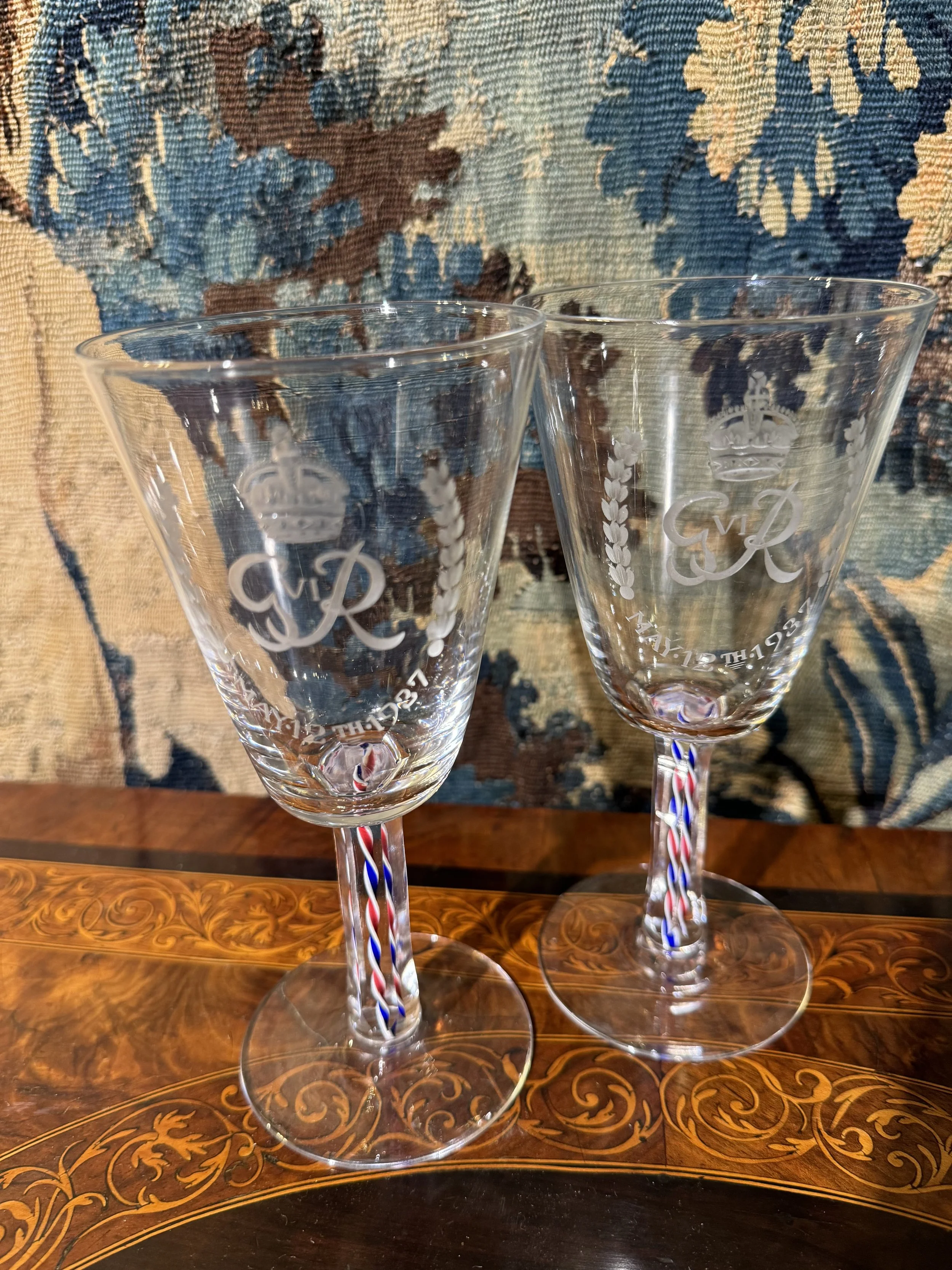 This is a picture of a fine and rare George VI Webb & Co engraved and enamel twist stem glass made for the 1937 coronation of King George VI, signed to the base.