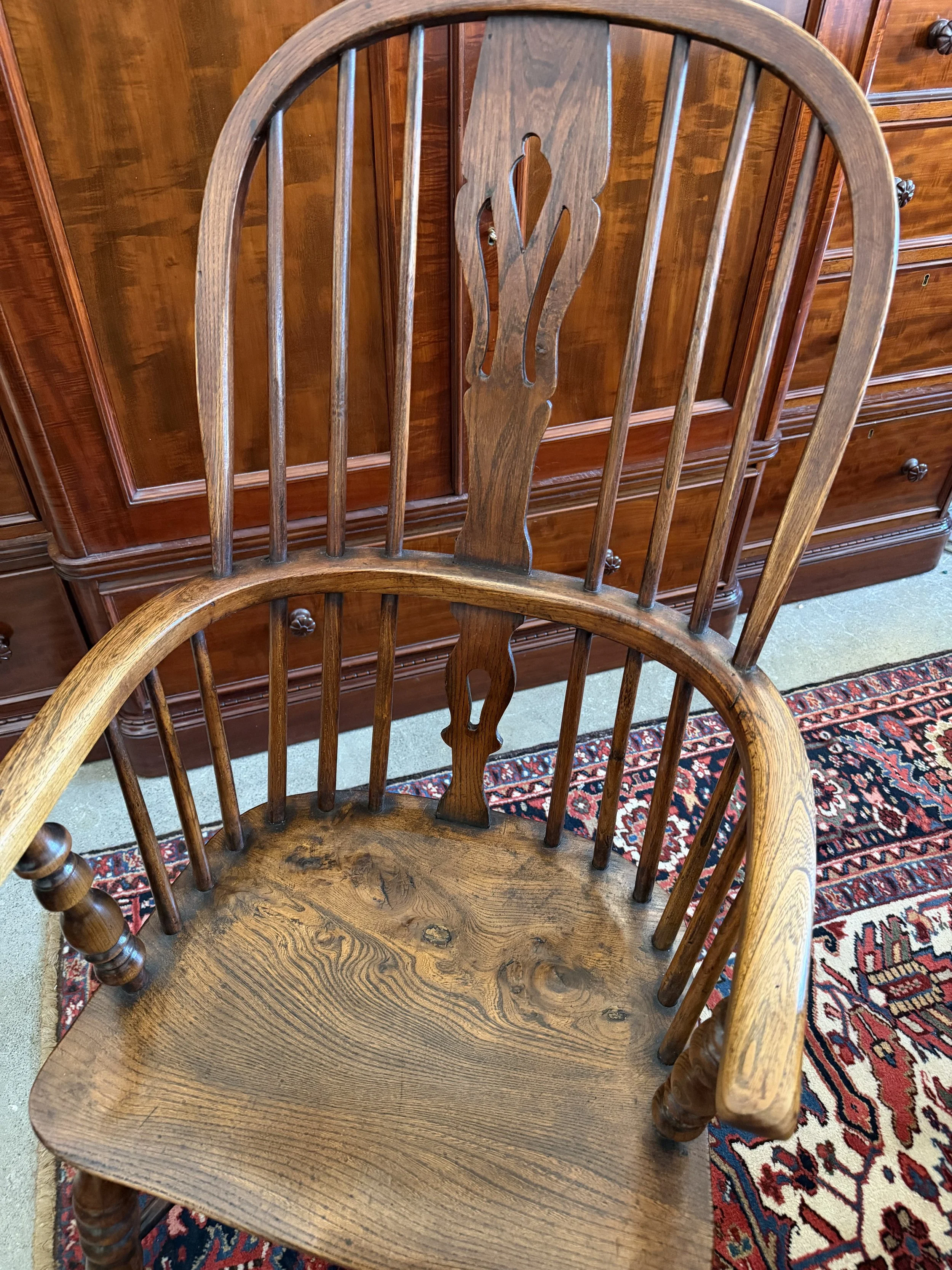 This is a picture of a beautiful mid 19th century high back Windsor armchair from Lincolnshire with a crinoline stretcher c1860.