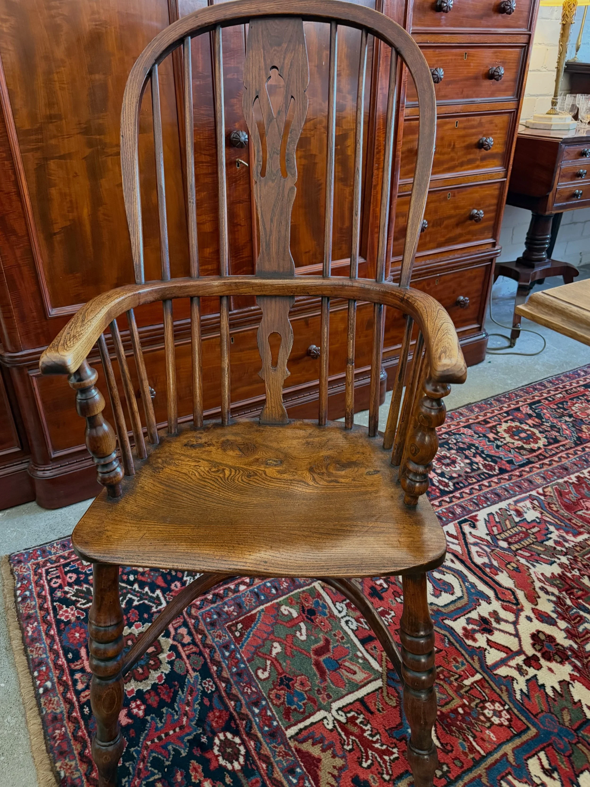 This is a picture of a beautiful mid 19th century high back Windsor armchair from Lincolnshire with a crinoline stretcher c1860.