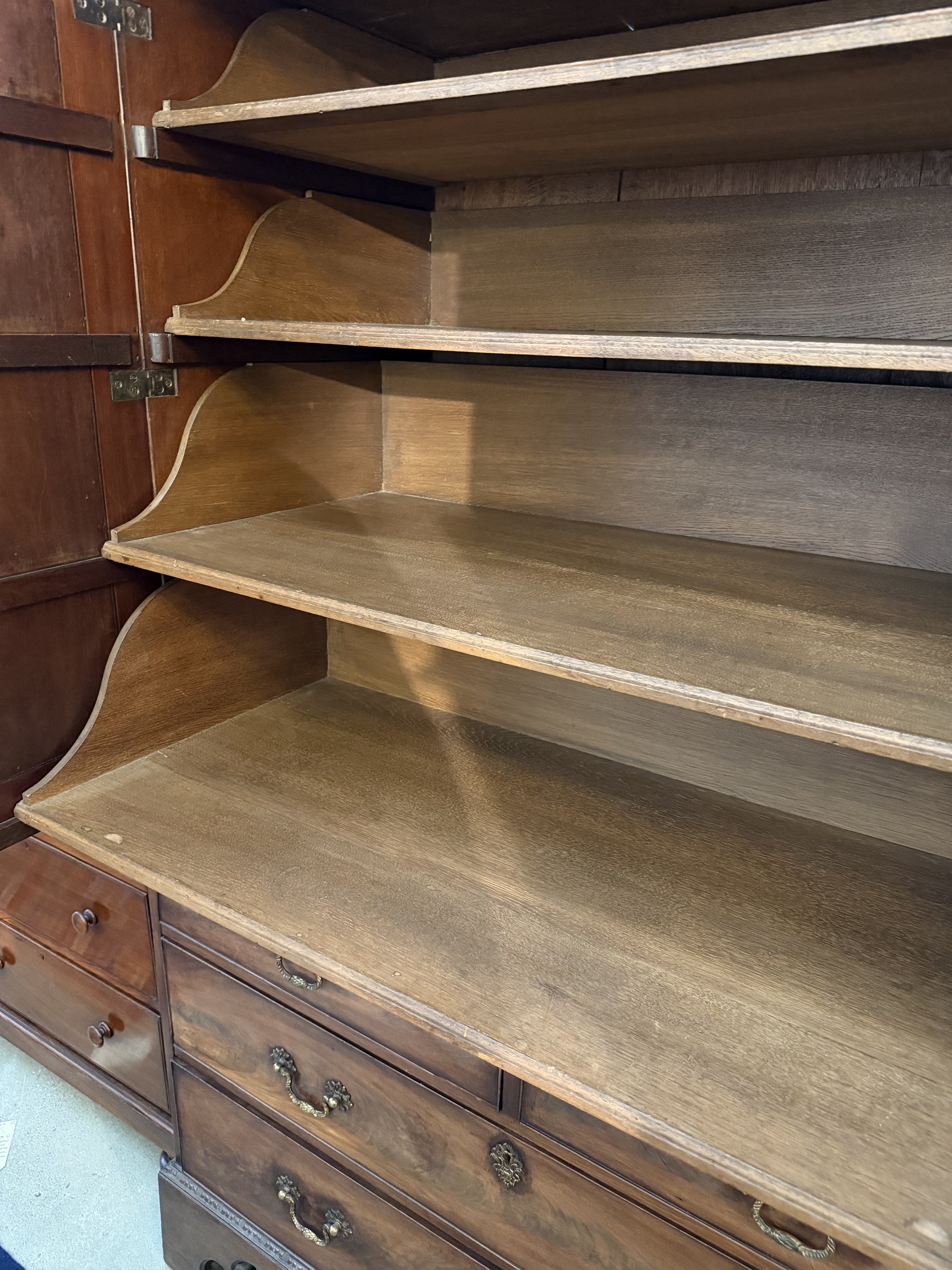 This is a picture of a very handsome George II period Cuban mahogany dwarf wardrobe with its original metalware in the manner of Giles Grendey c1750.