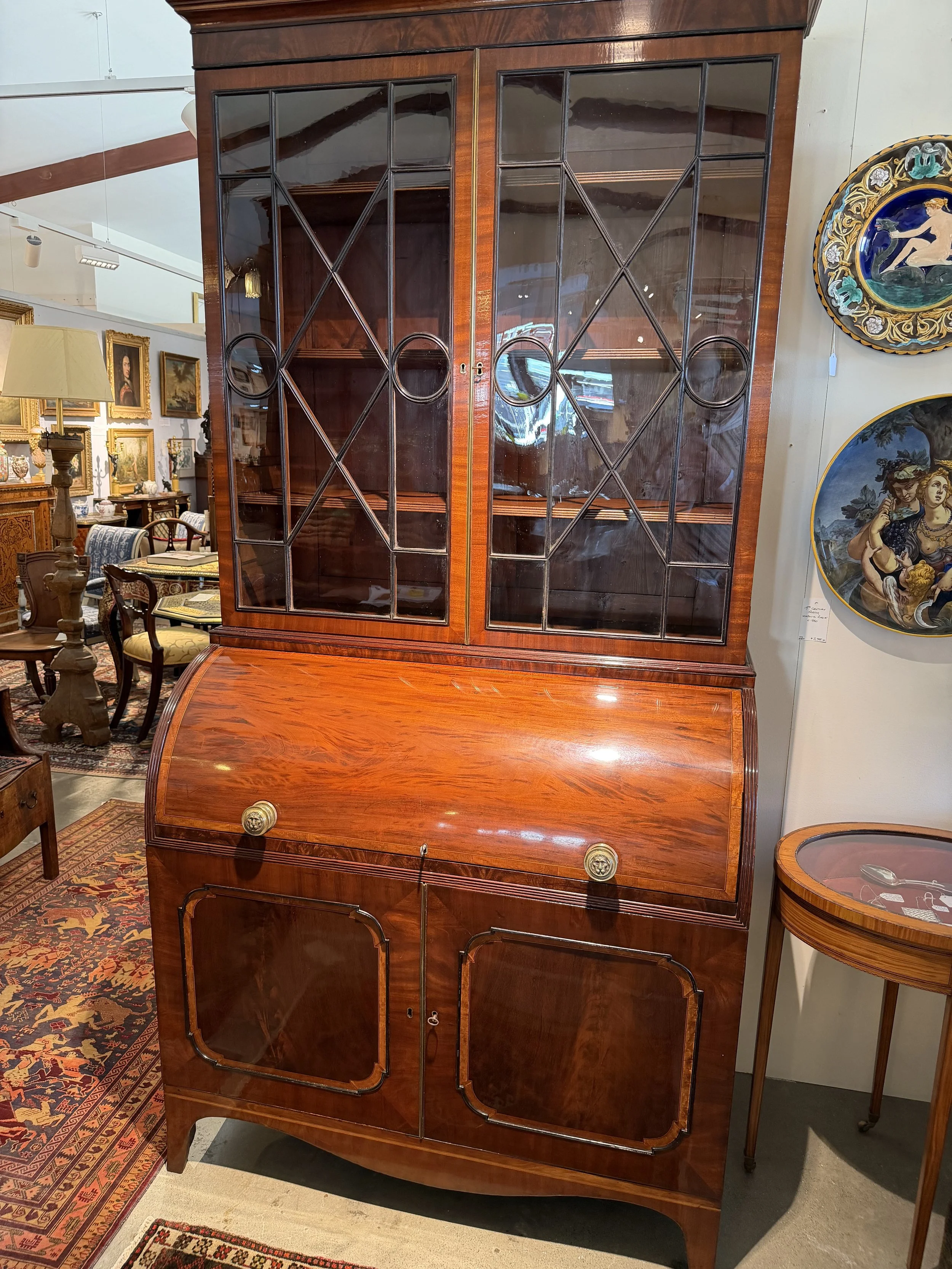 This is a picture of a fine quality satinwood cross banded mahogany cylinder bookcase c1810.