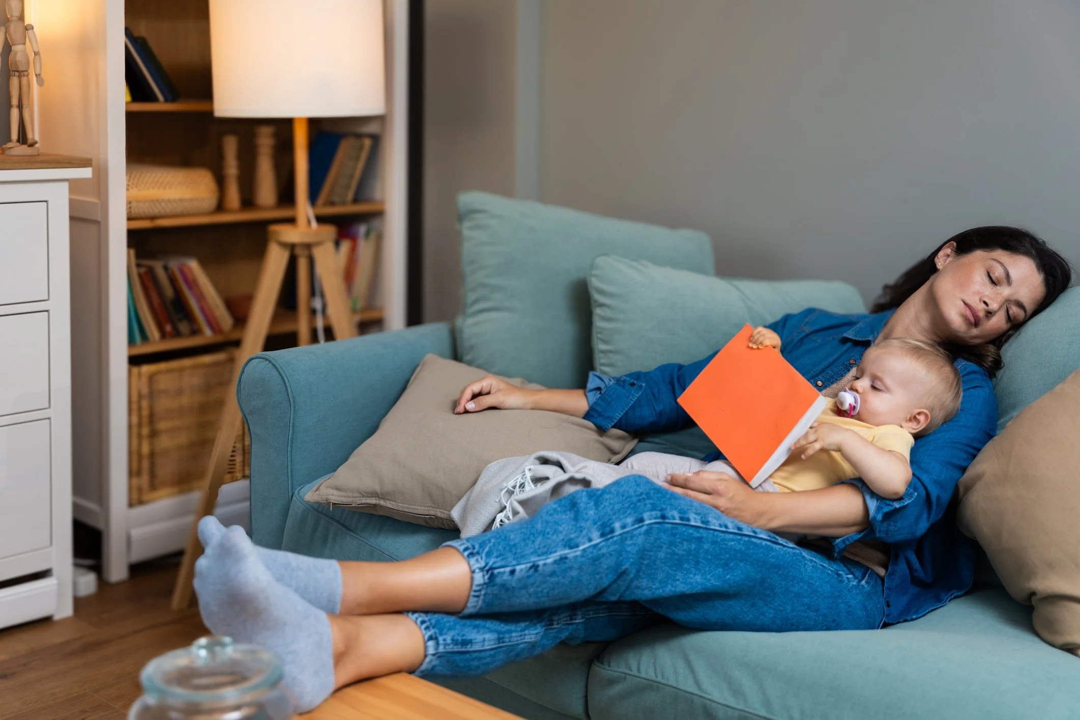 Mom holding newborn looking overwhelmed but calm, representing postpartum intrusive thoughts