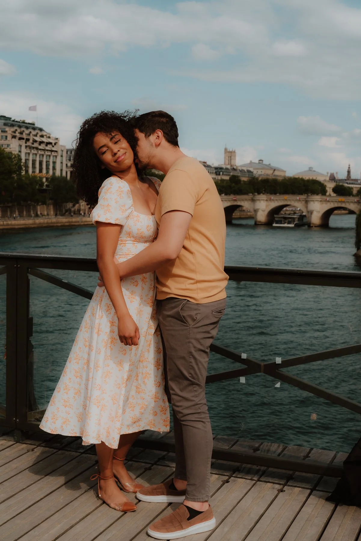 couple photoshoot in Paris by the Seine on the Pont des Arts bridge