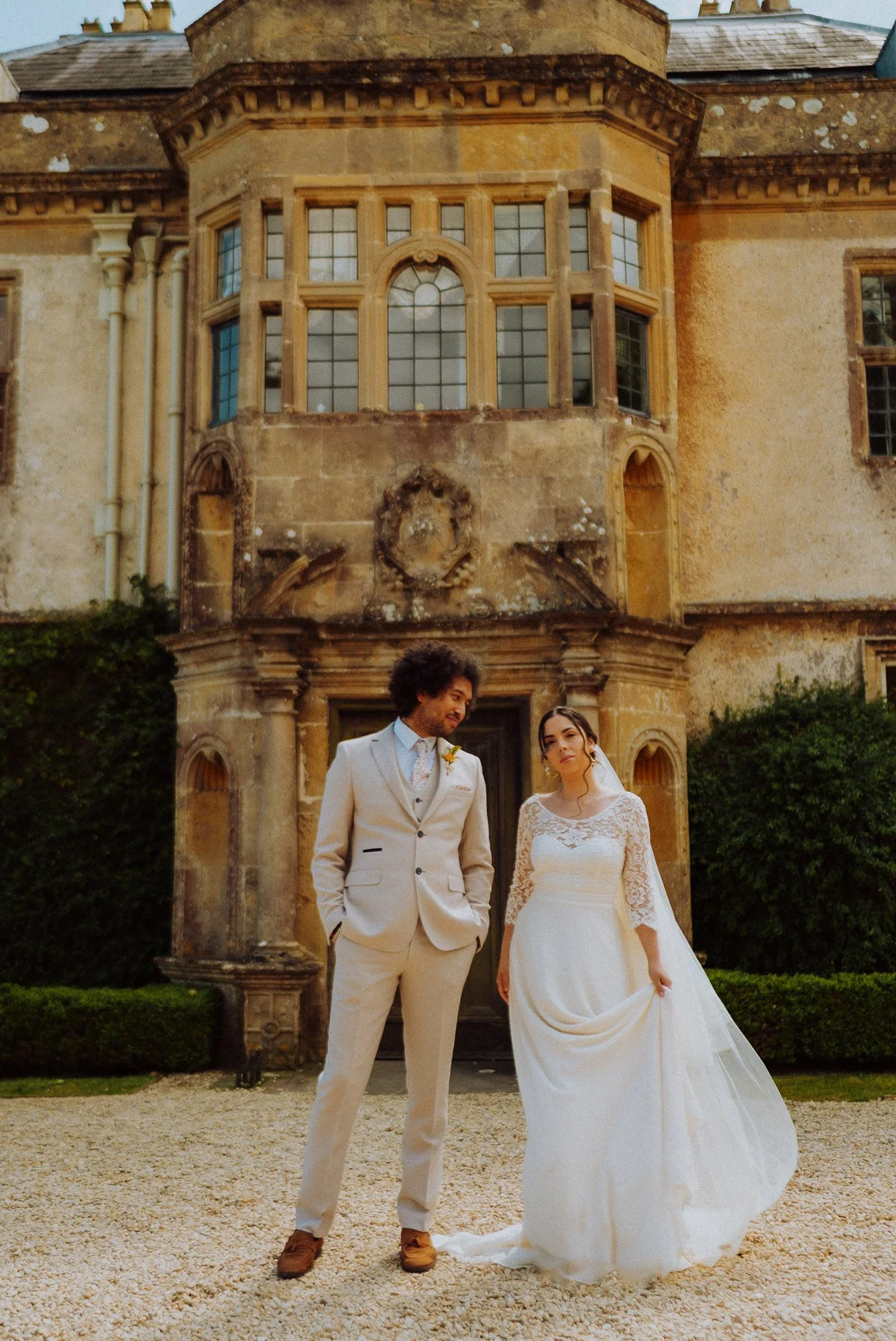 bride and groom standing in front of Hamswell House