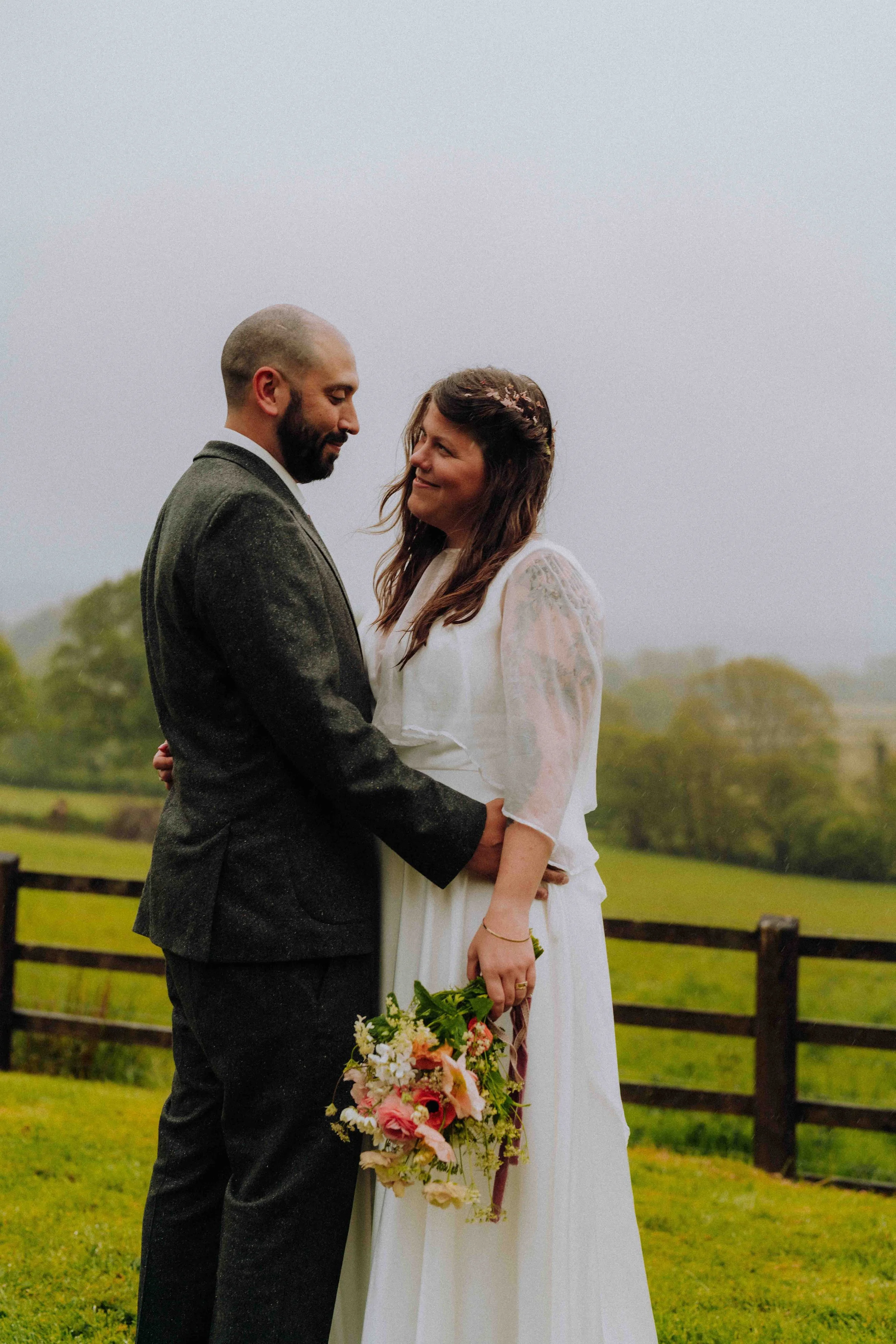 newly wed couple starring into each others eyes in the devon hills