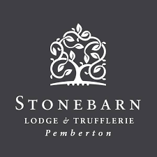 Logo for Stonebarn Lodge & Trufferie in Pemberton, featuring a stylized tree design against a dark background.