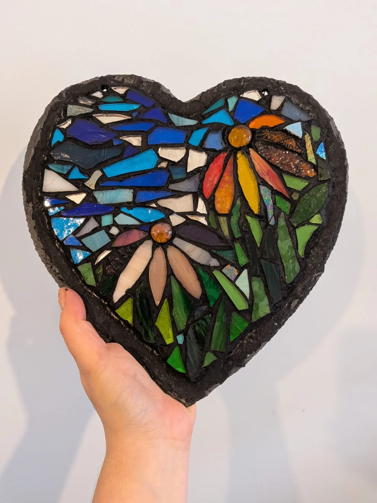 mosaic artwork of flowers in a heart