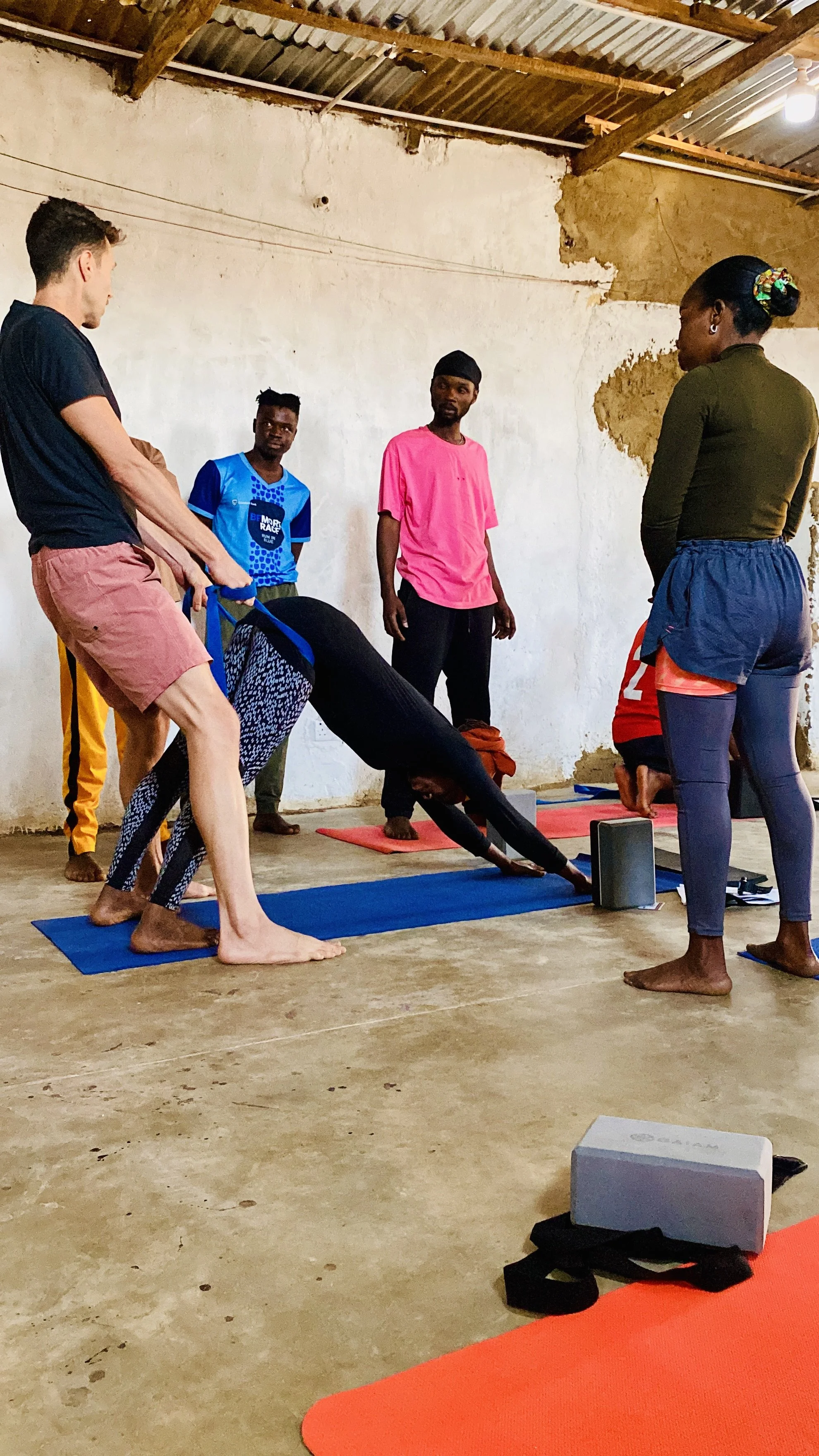 Dzaleka Yoga Teacher Training Downward Dog.jpeg