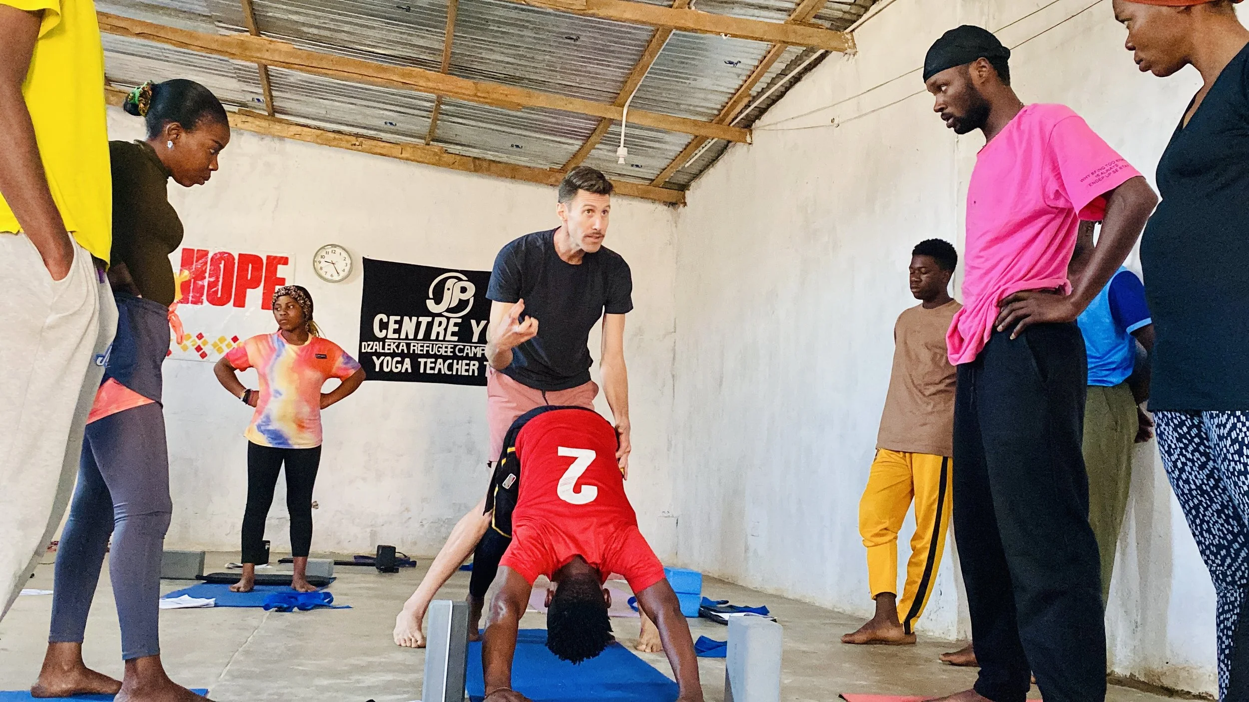 Dzaleka Yoga Teacher Training Downward Dog.jpeg