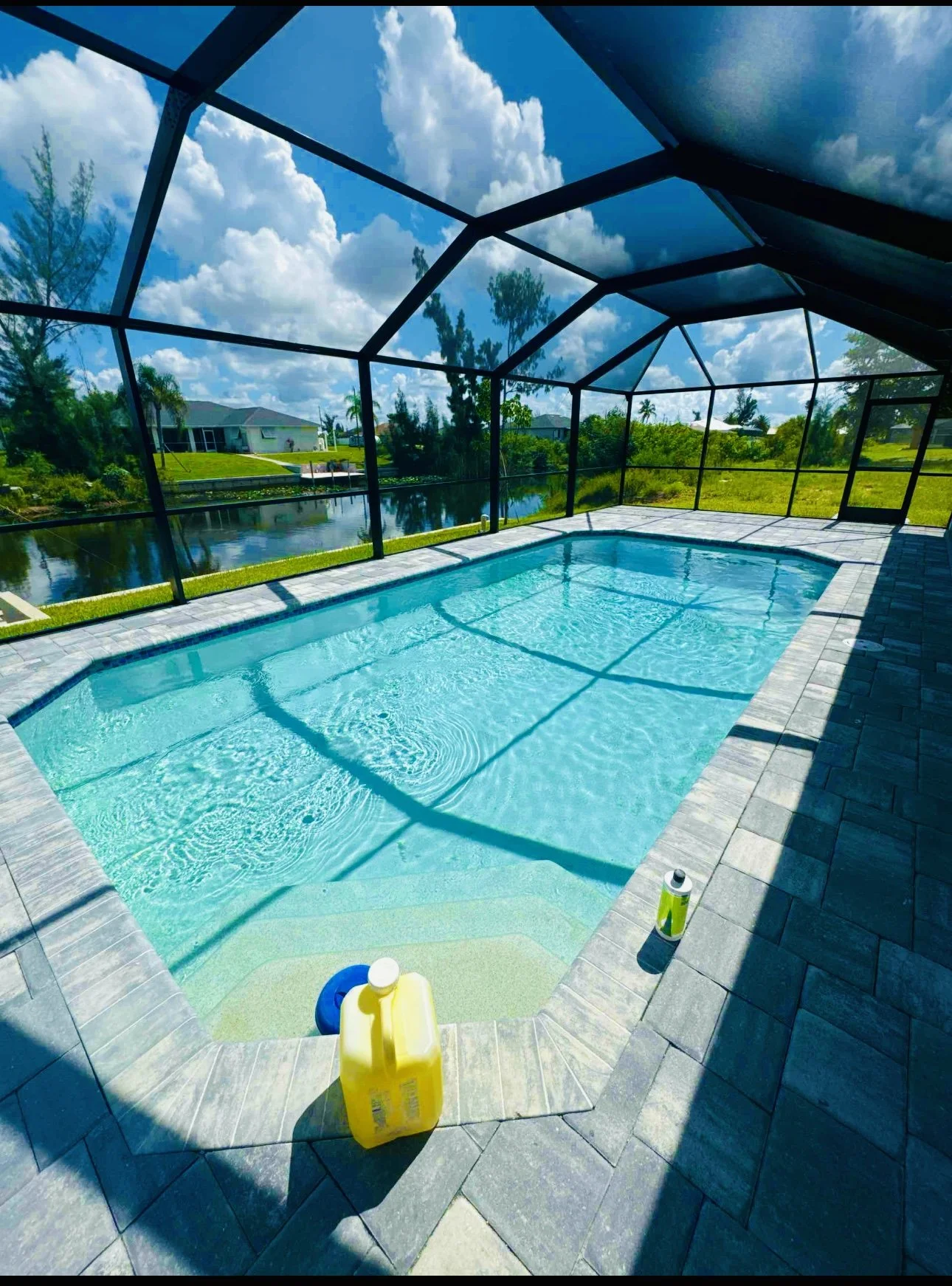 Before and after green pool cleanup completed by Brandon Pools in Cape Coral, Florida. Our team transformed this algae-filled swimming pool into crystal-clear blue water through professional pool cleaning, water chemistry balancing, filtration improv