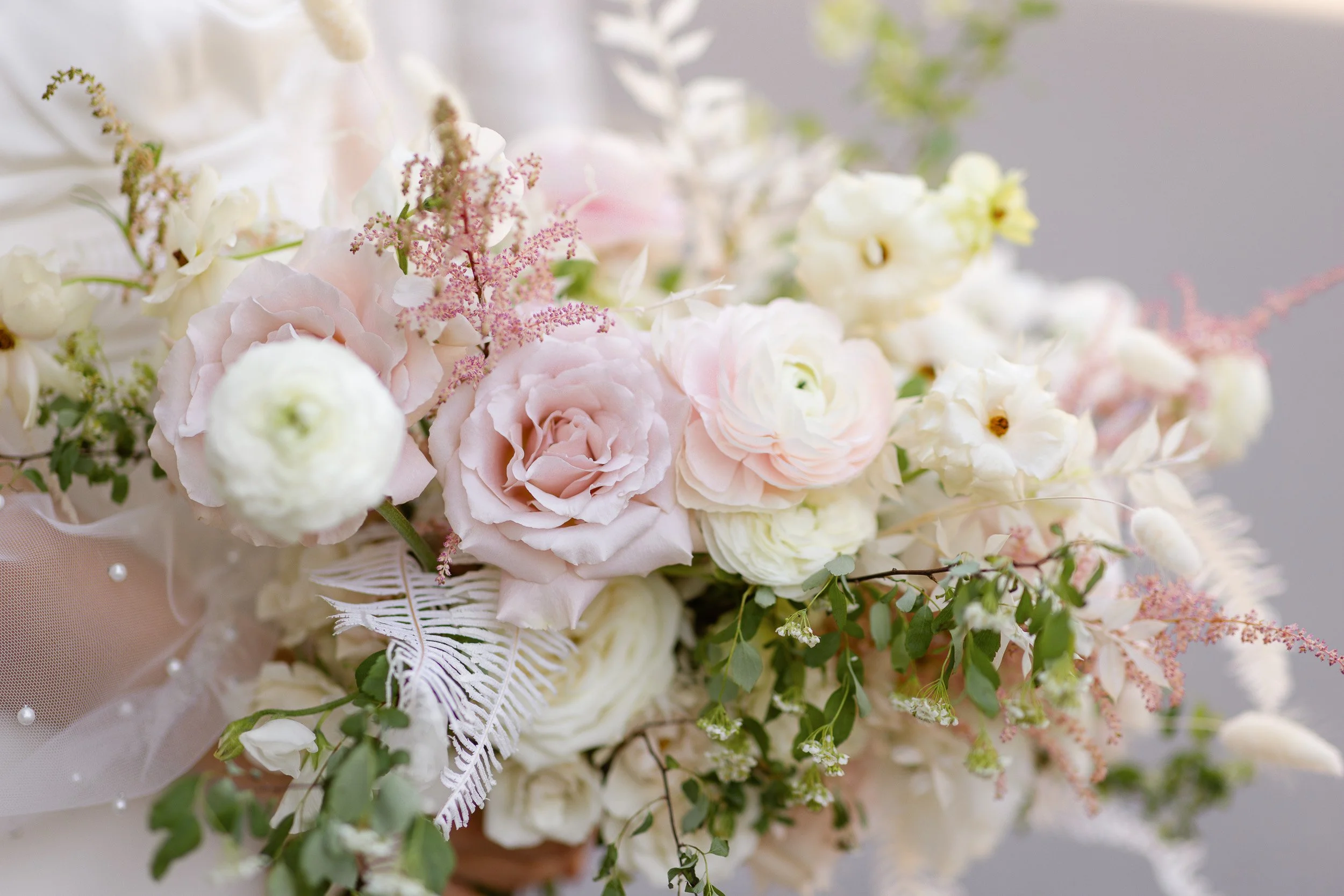 Close-up of a pastel-colored flower arrangement with pink, white, and cream blossoms during elopement in Upstate, SC
