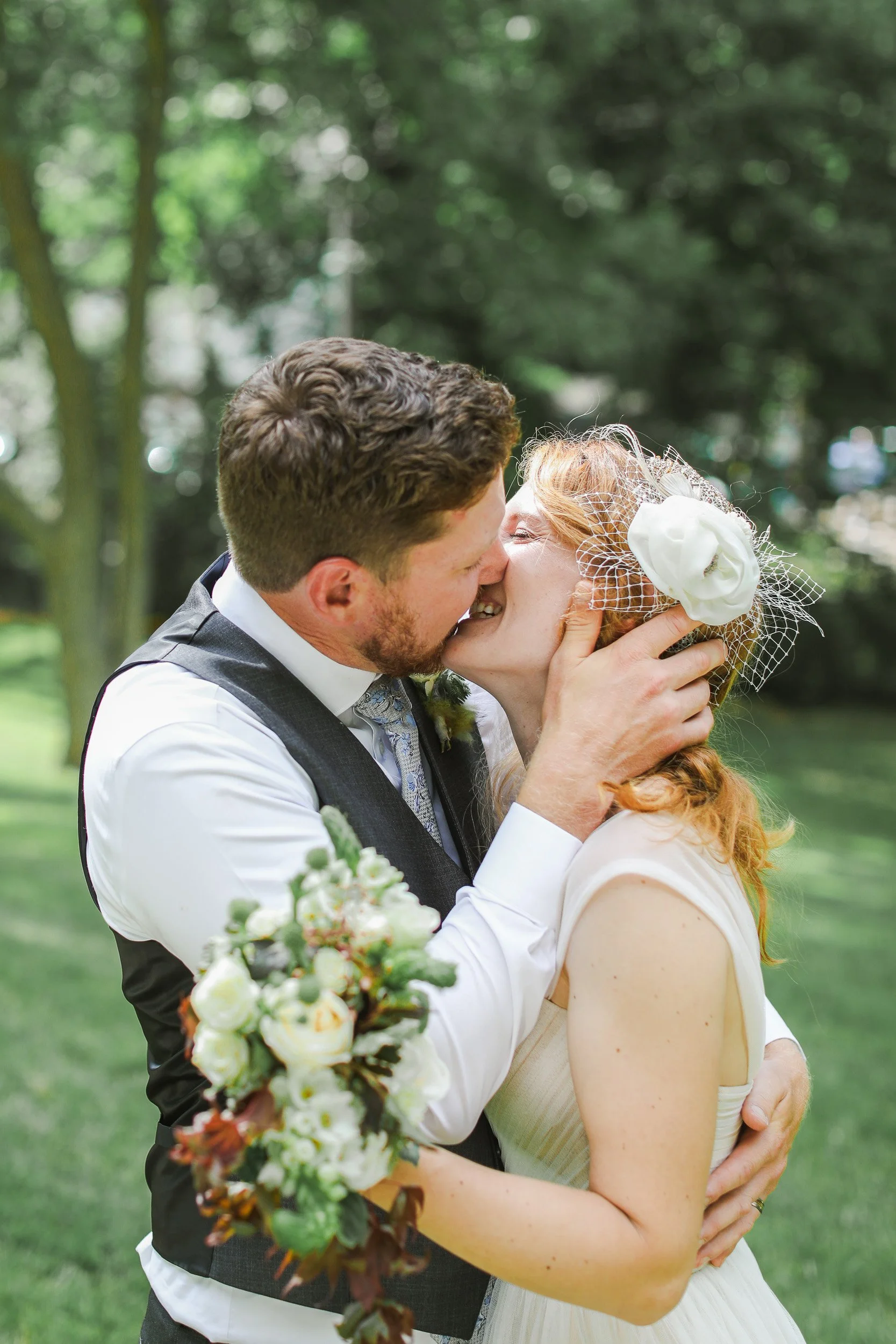 A couple kissing outdoors during an intimate wedding in Greenville SC