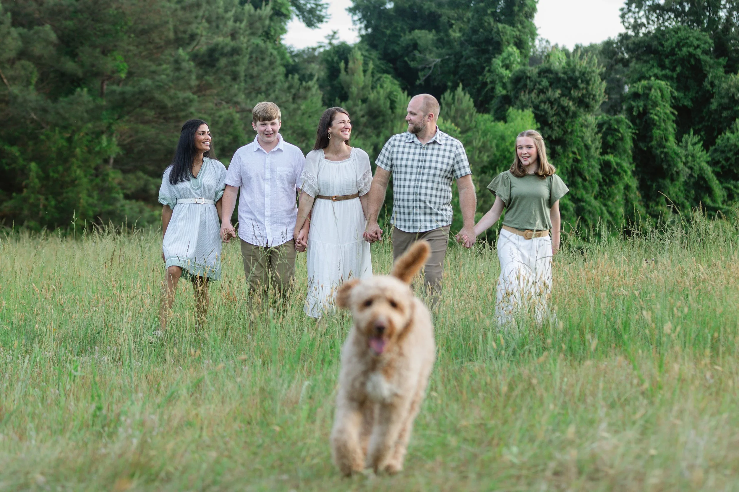 Family walking together during a golden hour photography session in Central South Carolina