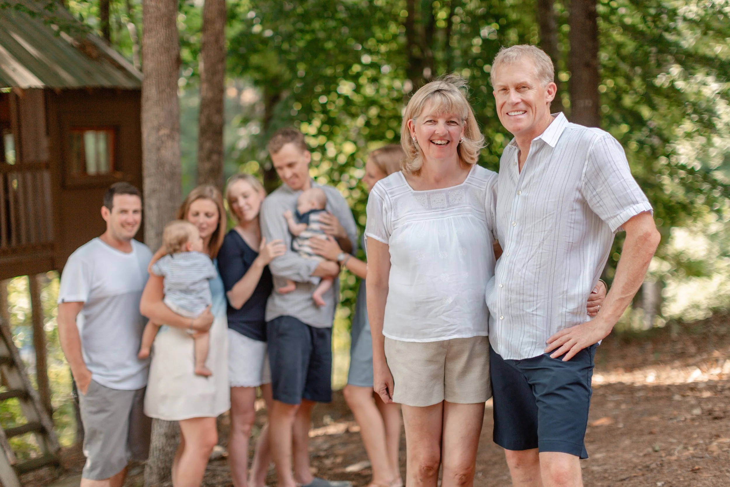 Multi-generational family portrait with grandparents, parents, and children photographed outdoors in South Carolina