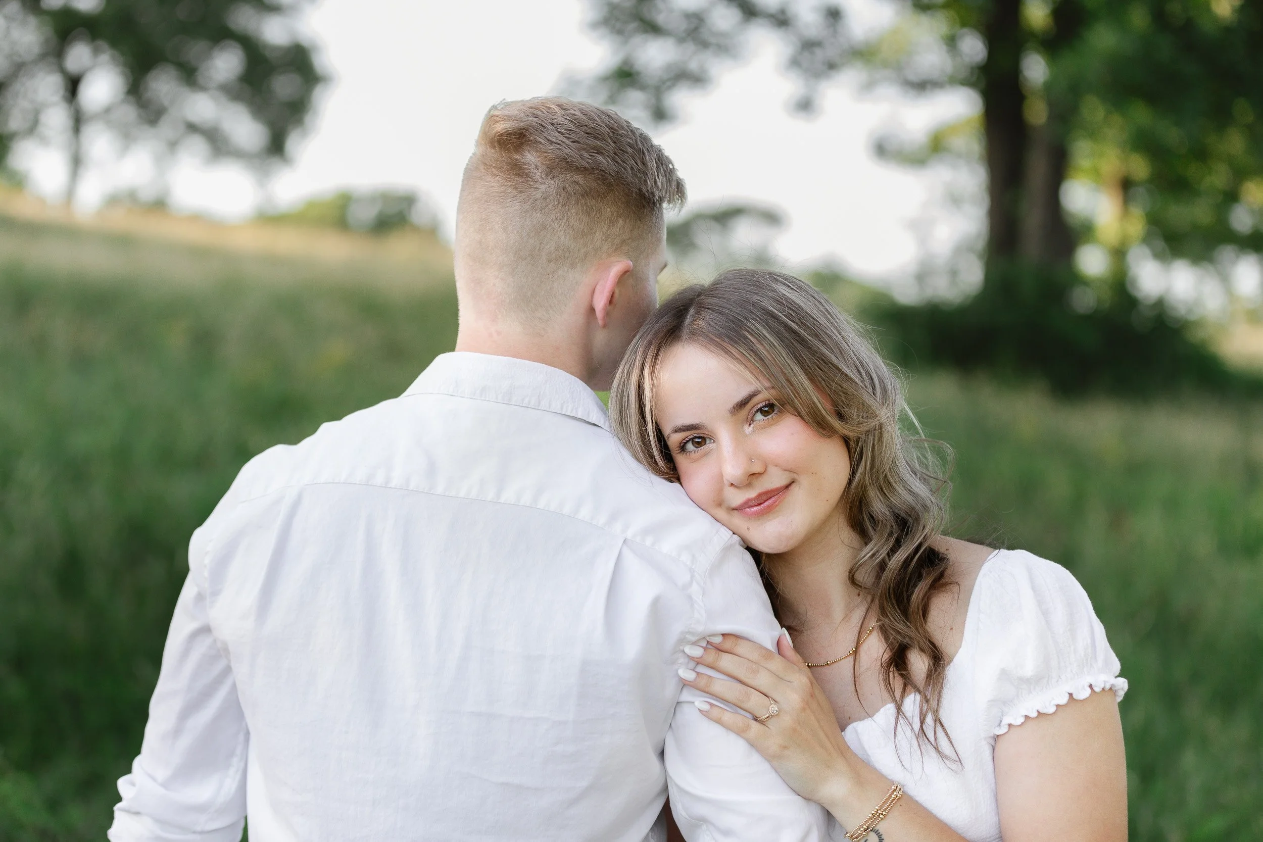 Couple during engagement photoshoot in a field in Clemson SC