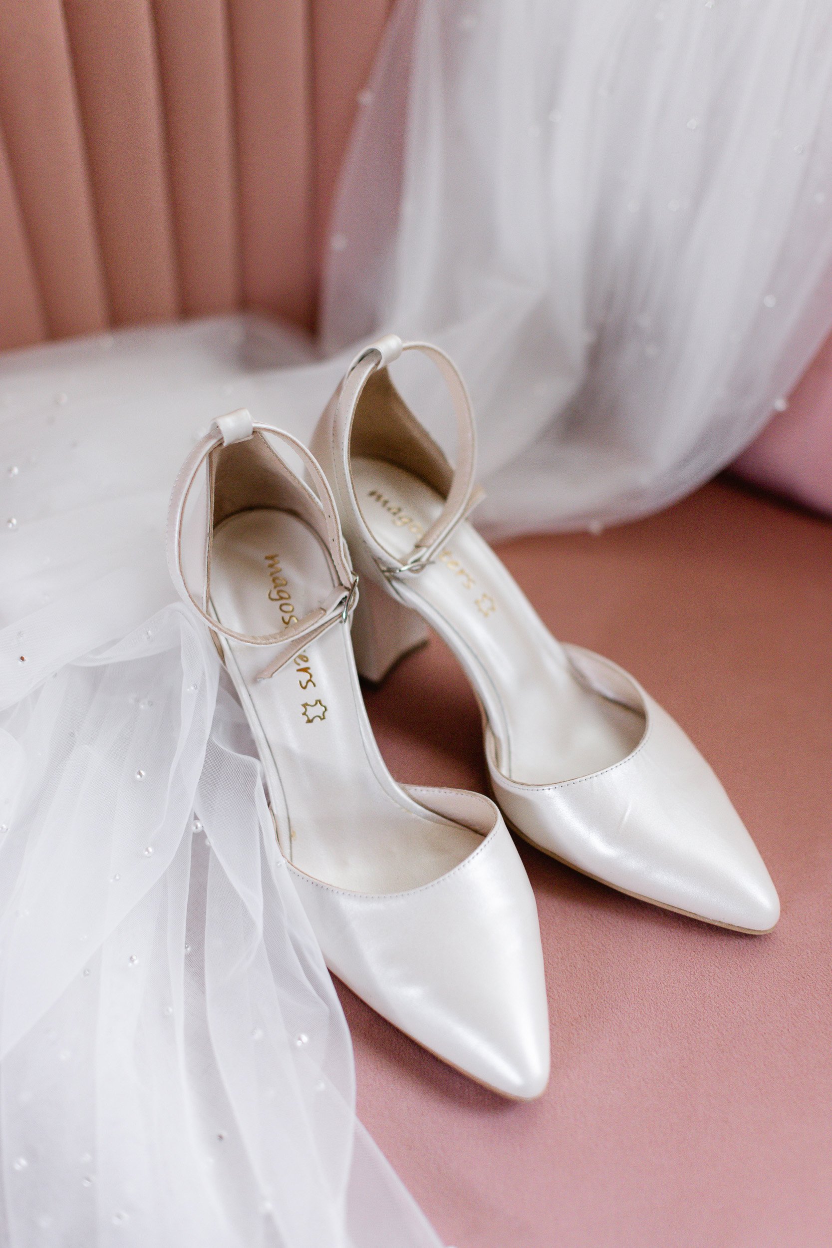 A pair of white wedding shoes during a small wedding in Clemson, SC