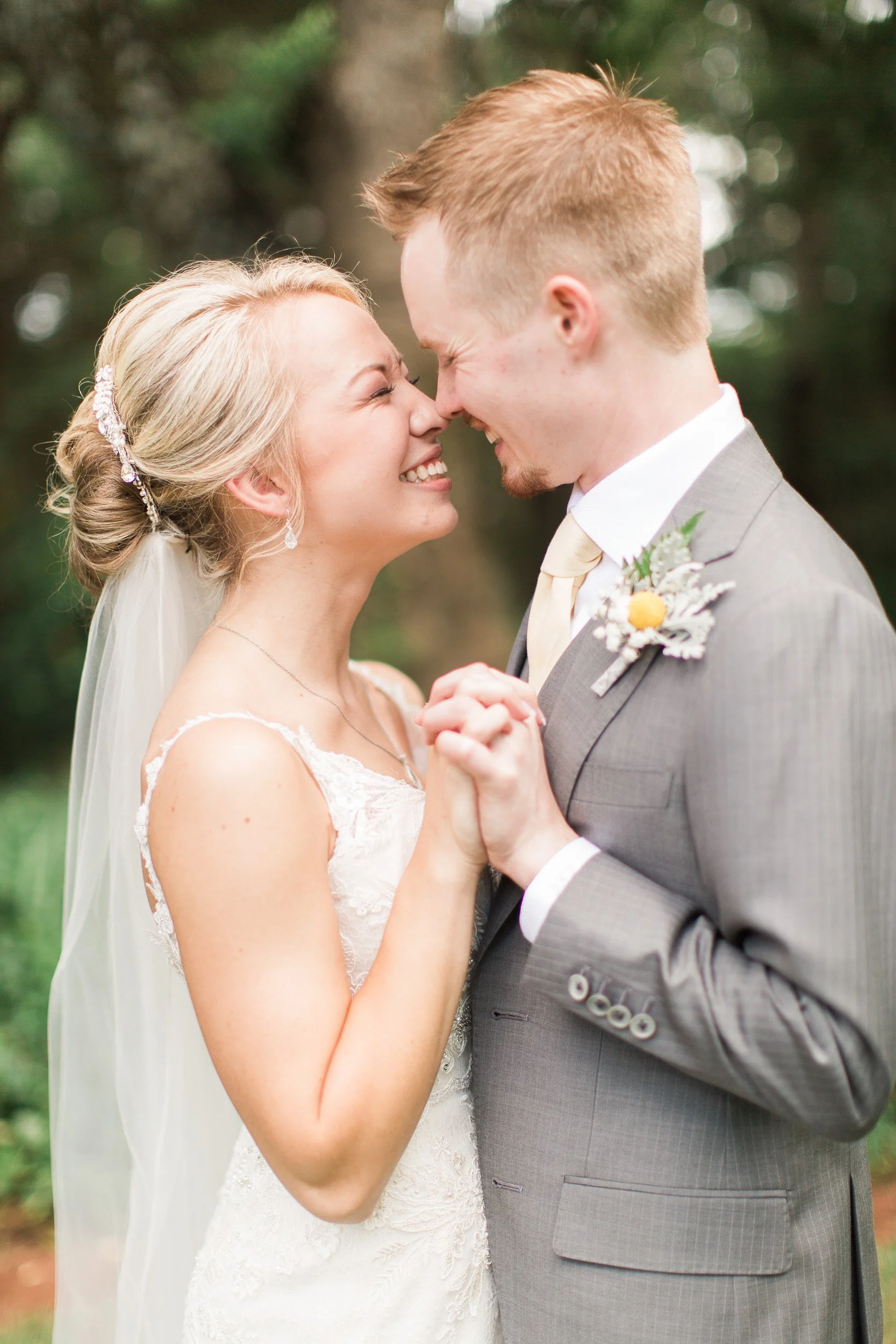 A bride and groom smiling at each other during wedding in Pendleton, SC