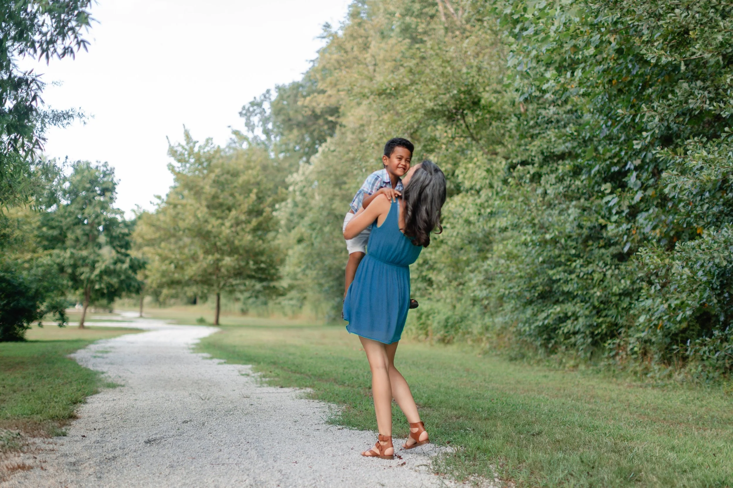 Mother holding son on a pathway during photoshoot in Clemsn South Carolina
