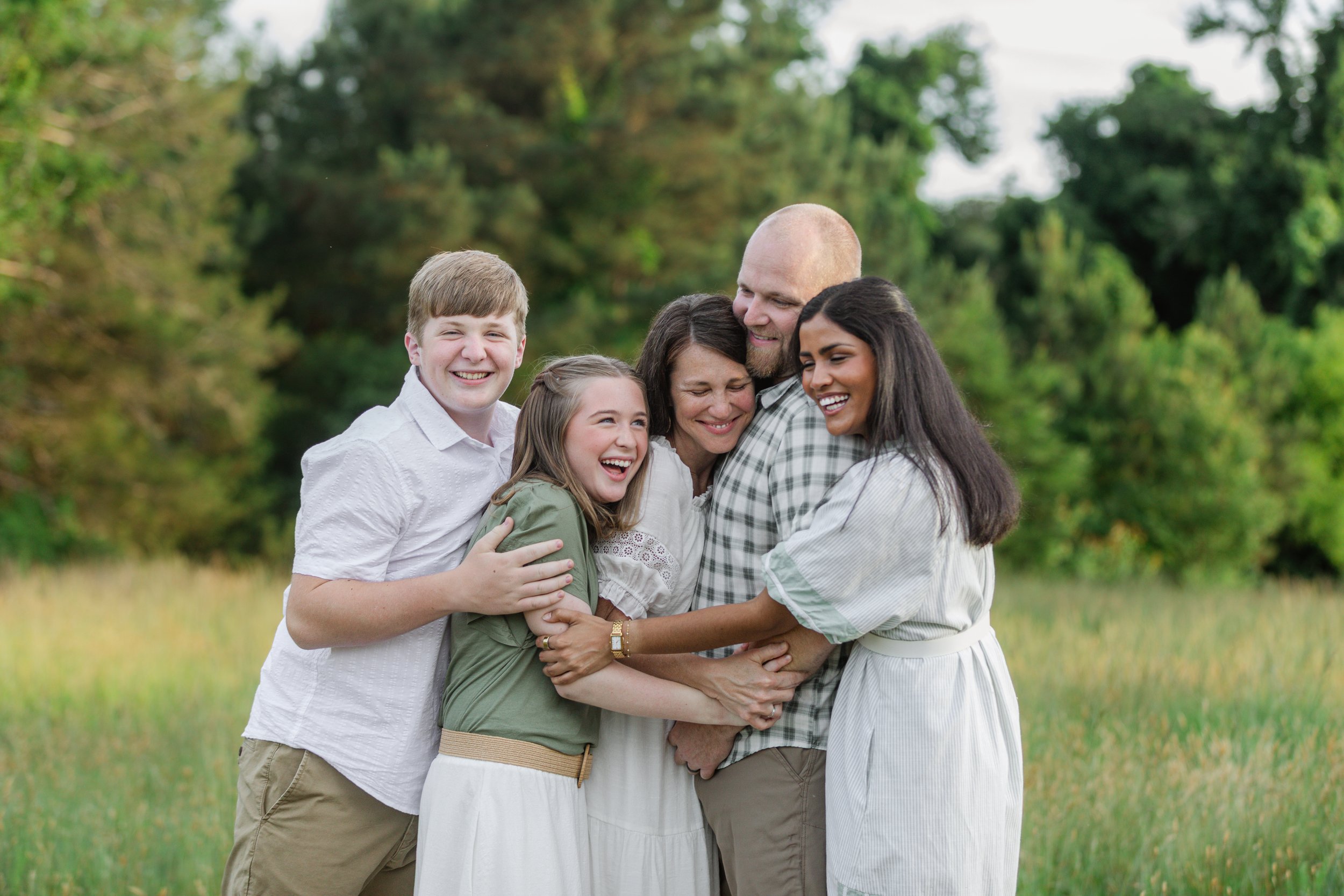 Family hugging in natural light photography Clemson South Carolina