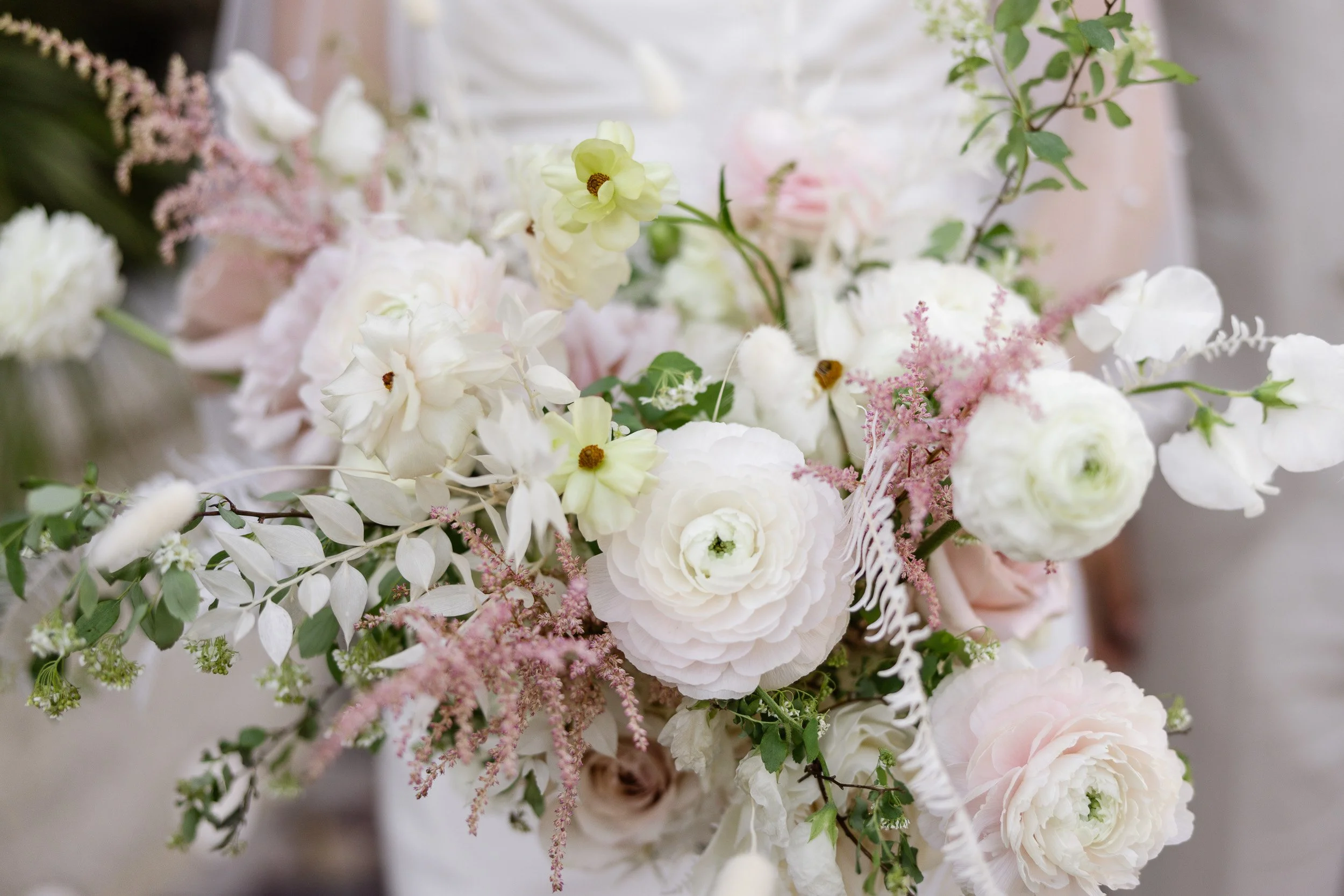Close-up of a bouquet of white and pale pink flowers during intimate wedding in Travelers Rest, SC