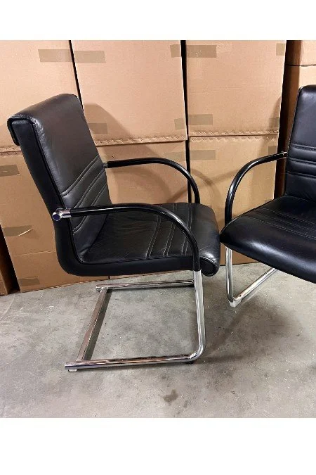 used black leather armchairs 2.jpg