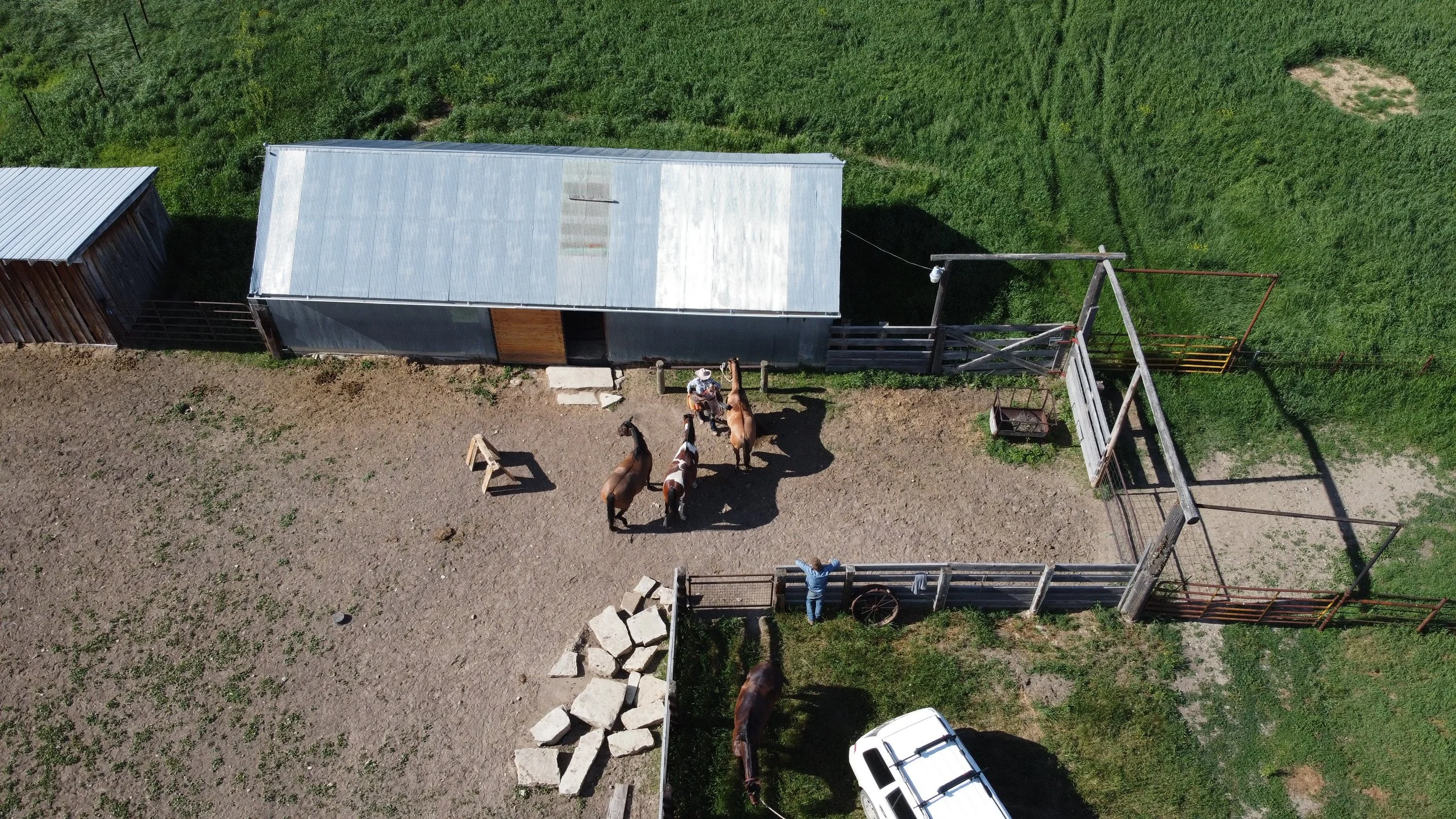 Arial of cowboys at barn, Kite Ranch, Montana