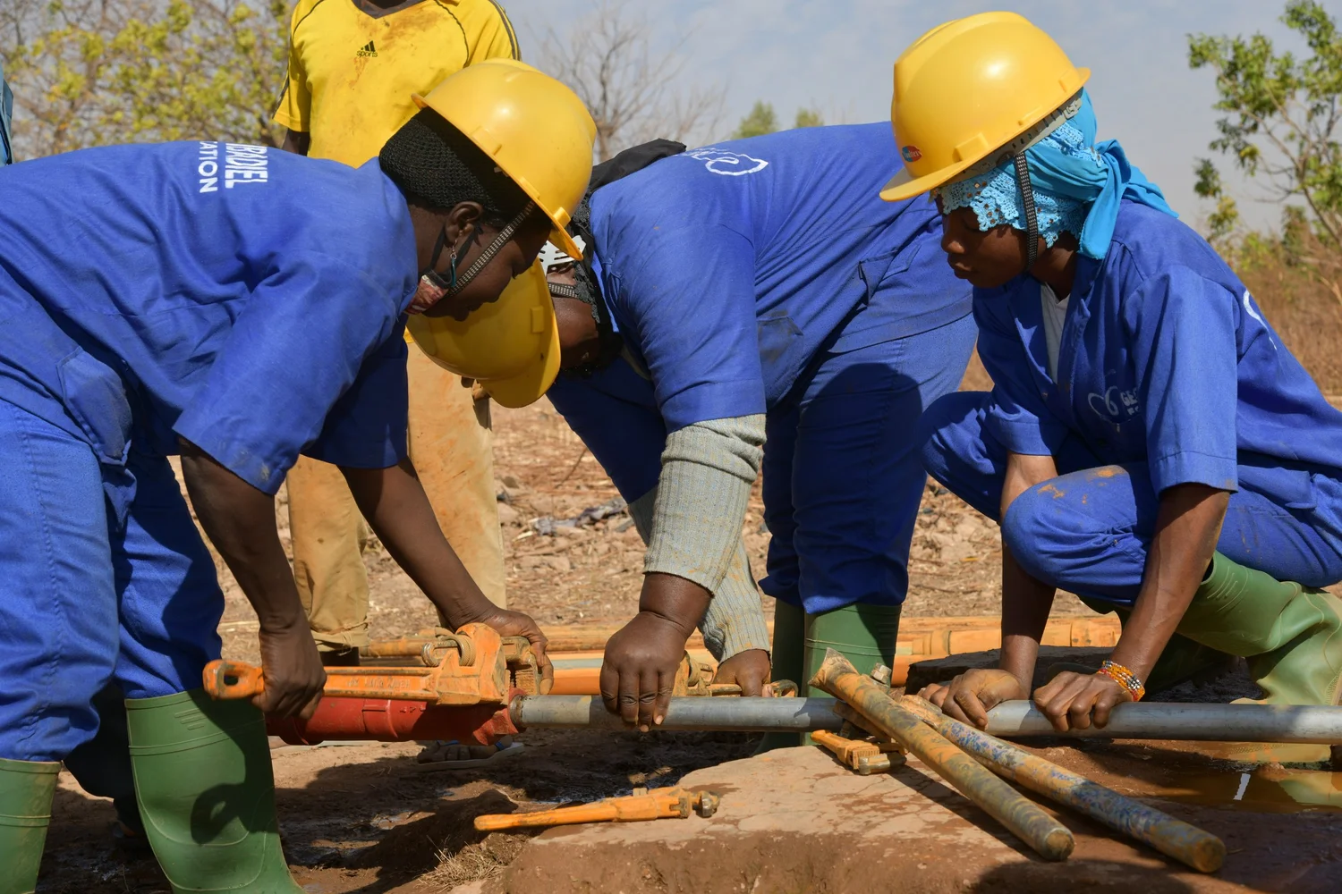 Women participating in hands-on water engineering training