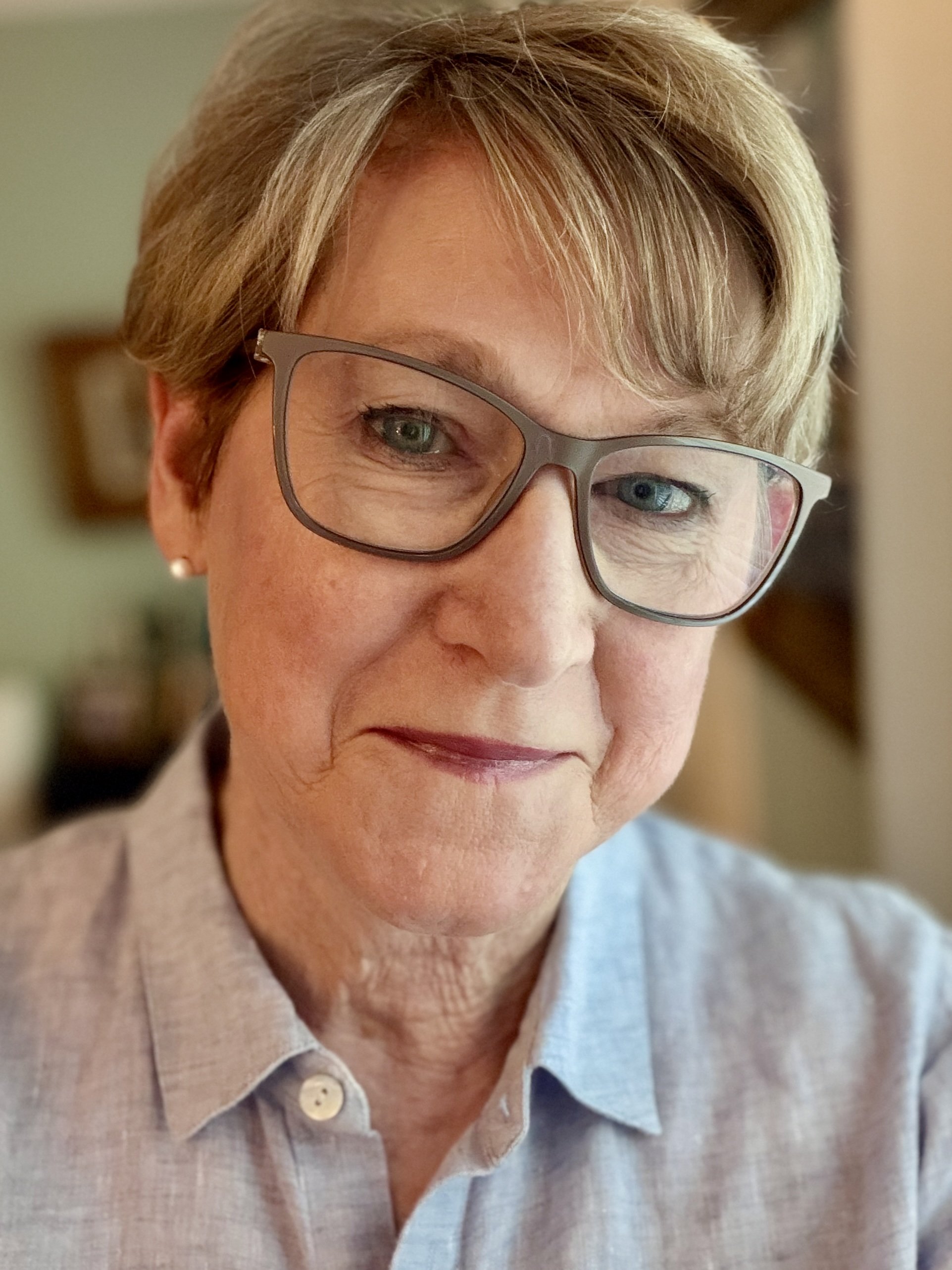 Susan Byrum Rountree, a woman with short blond hair and brown glasses