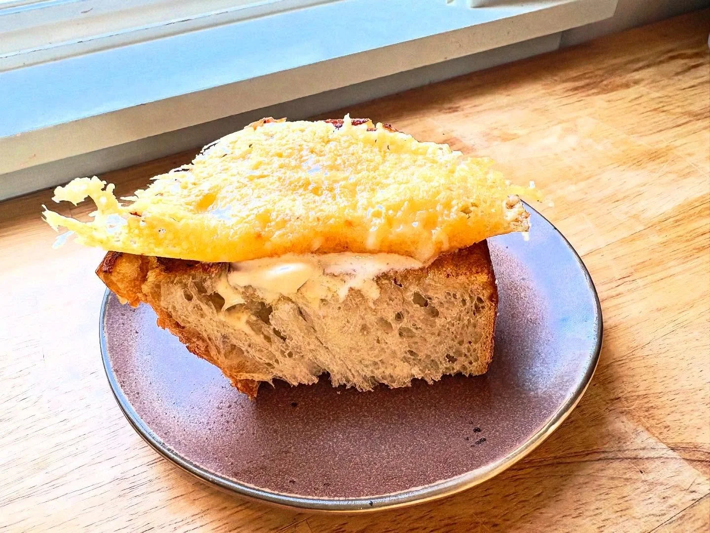 On the new.. Our cheese plate. 
@9beanrows sourdough 
@leelanaucheese raclette 

Grilled bread. Crispy, gooey cheese. 
Funky. Delicious. Cheesy. 

Patio weather is still here. So is BLT season. 
Come on down. Reservations available.  Grab a glass gra