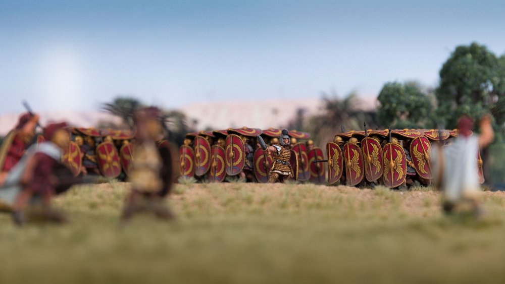  Roman testudos are harassed by Ptolemaic skirmishers as they approach the royal army’s fortified camp along the shores of the Nile. Nile Delta, Ptolemaic Egypt, 47 BC. 