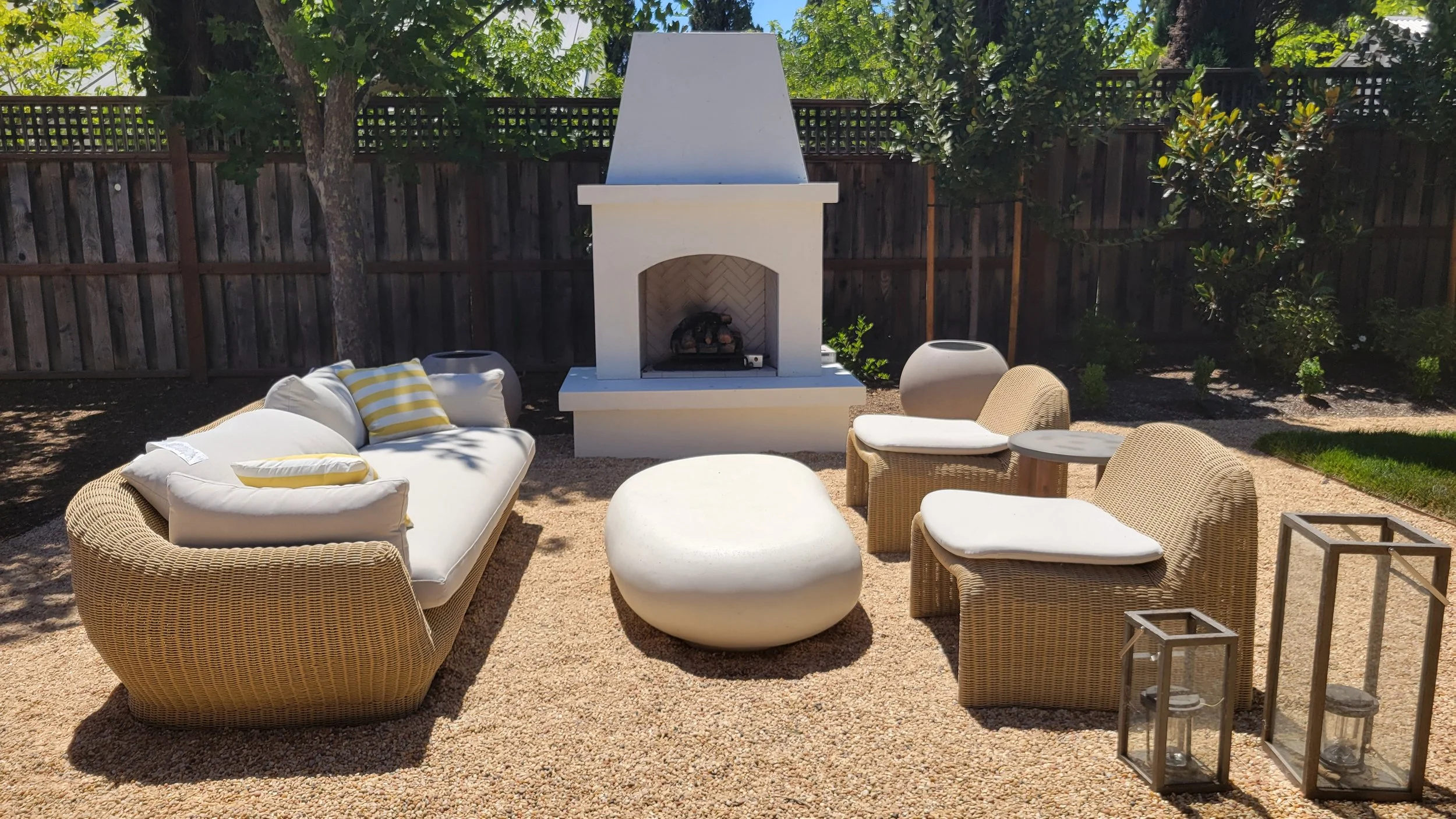 outdoor fireplace with wicker seating