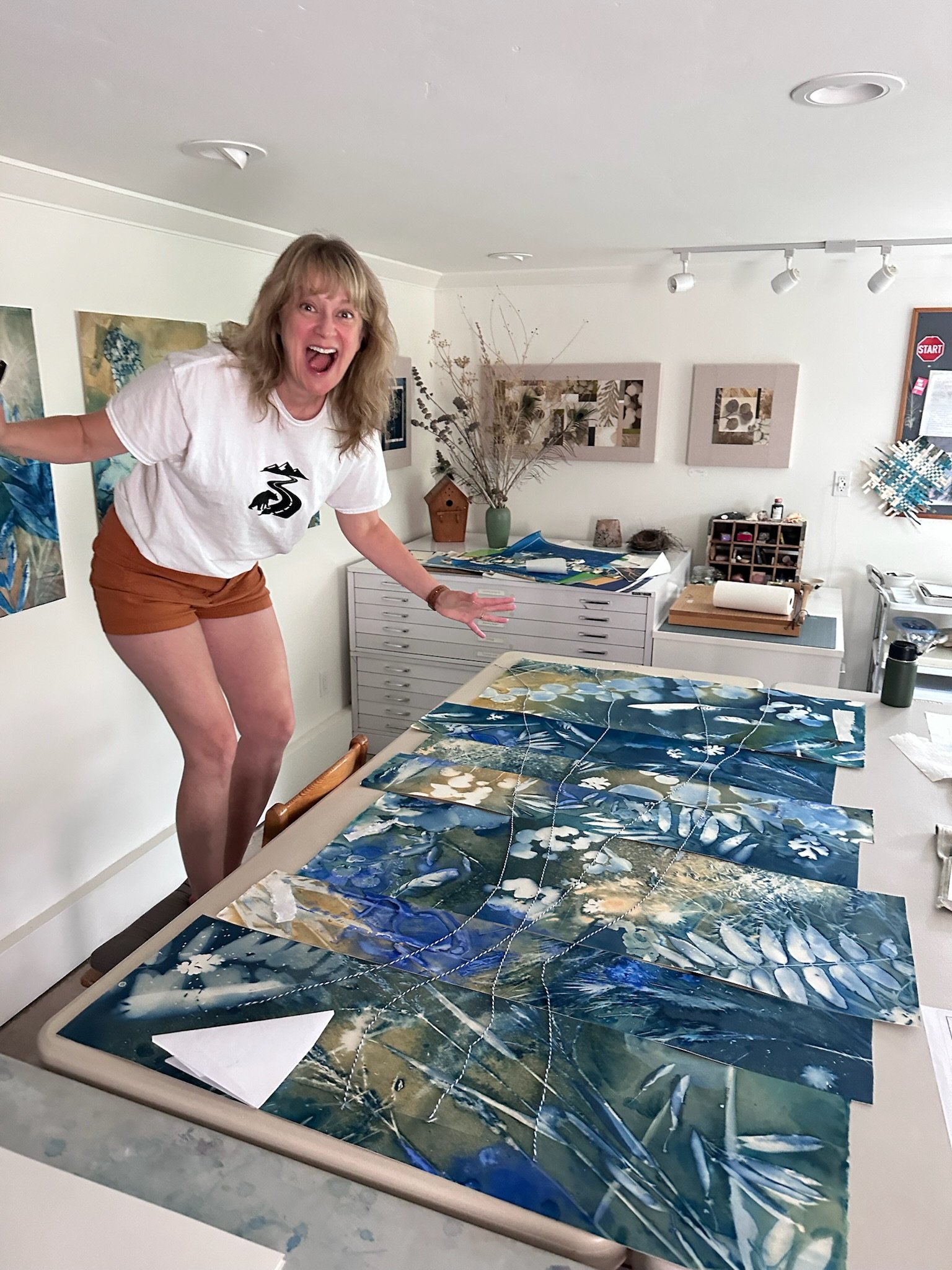 Kate Farrall showing off early stages of the art piece for the Axis Birds & Bikes exhibition, a collaboration with artist, Linda Clark Johnson.