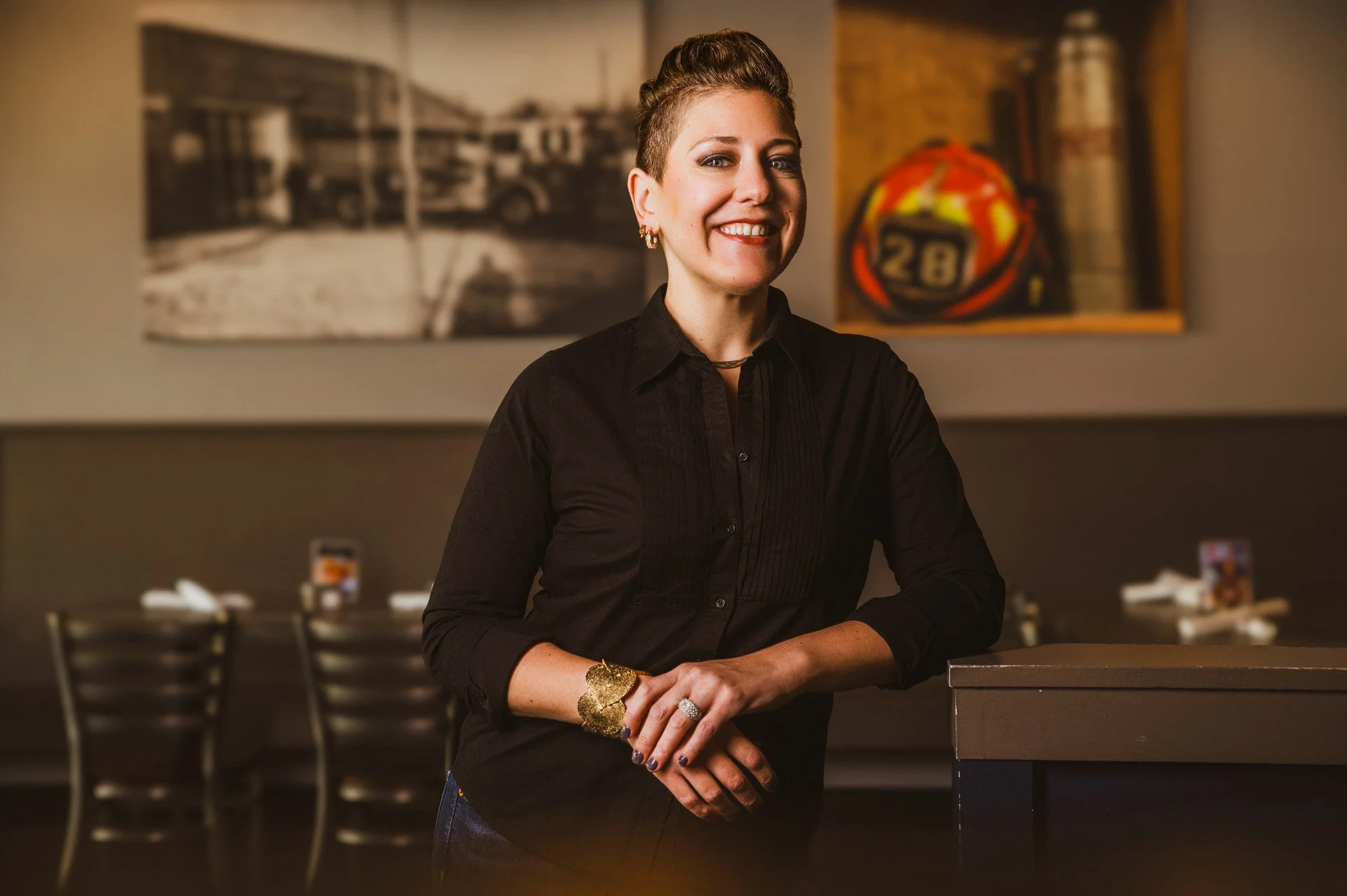 Young woman poses for branding photos in an Atlanta area bar.