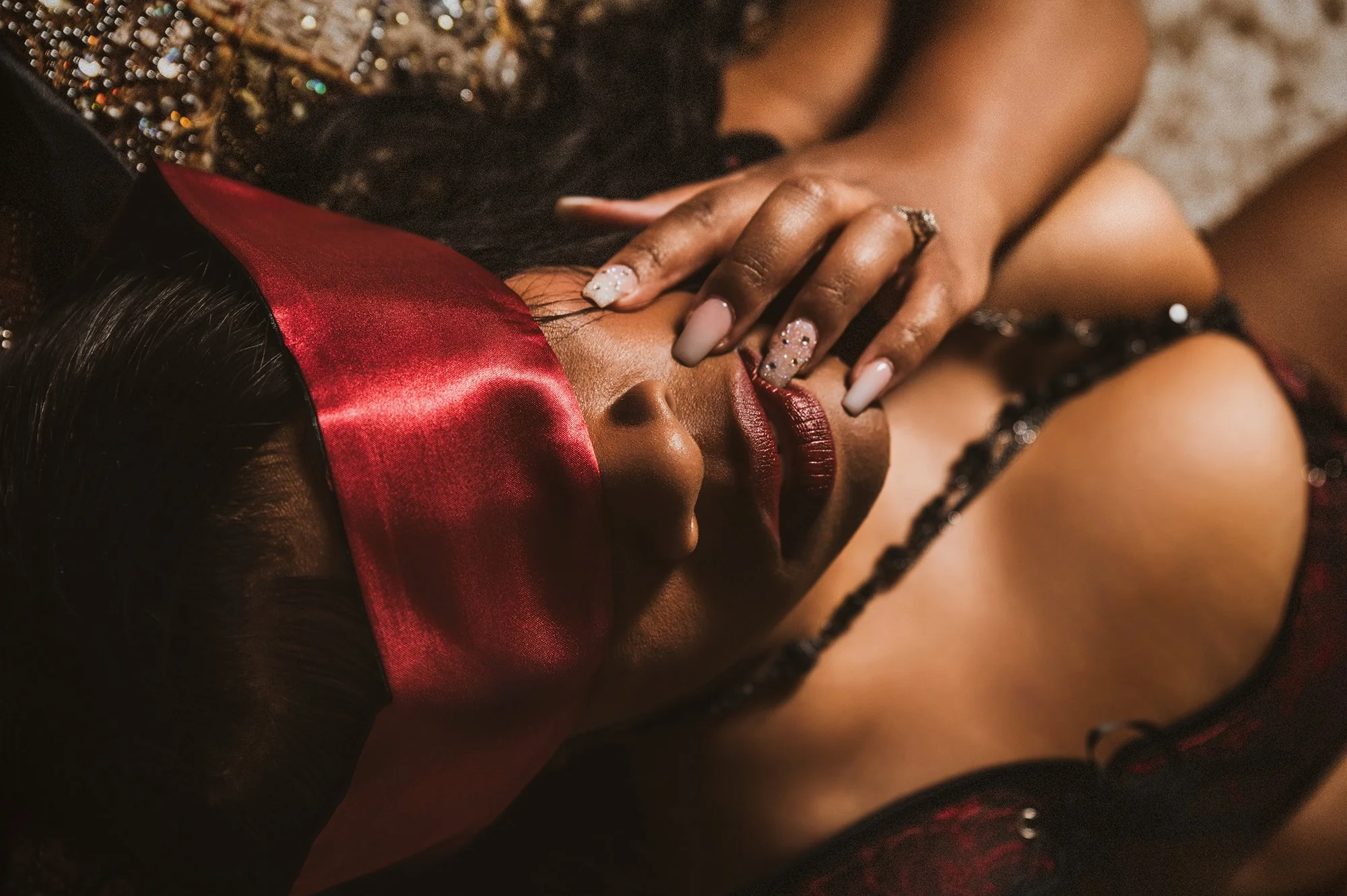 sensual boudoir photo with red blindfold.