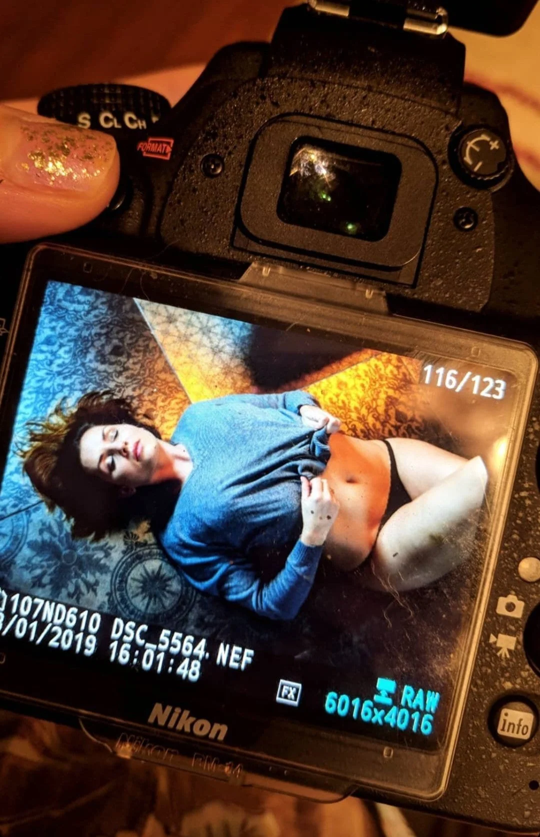 Camera-back preview during boudoir session Atlanta, photographer showing screen