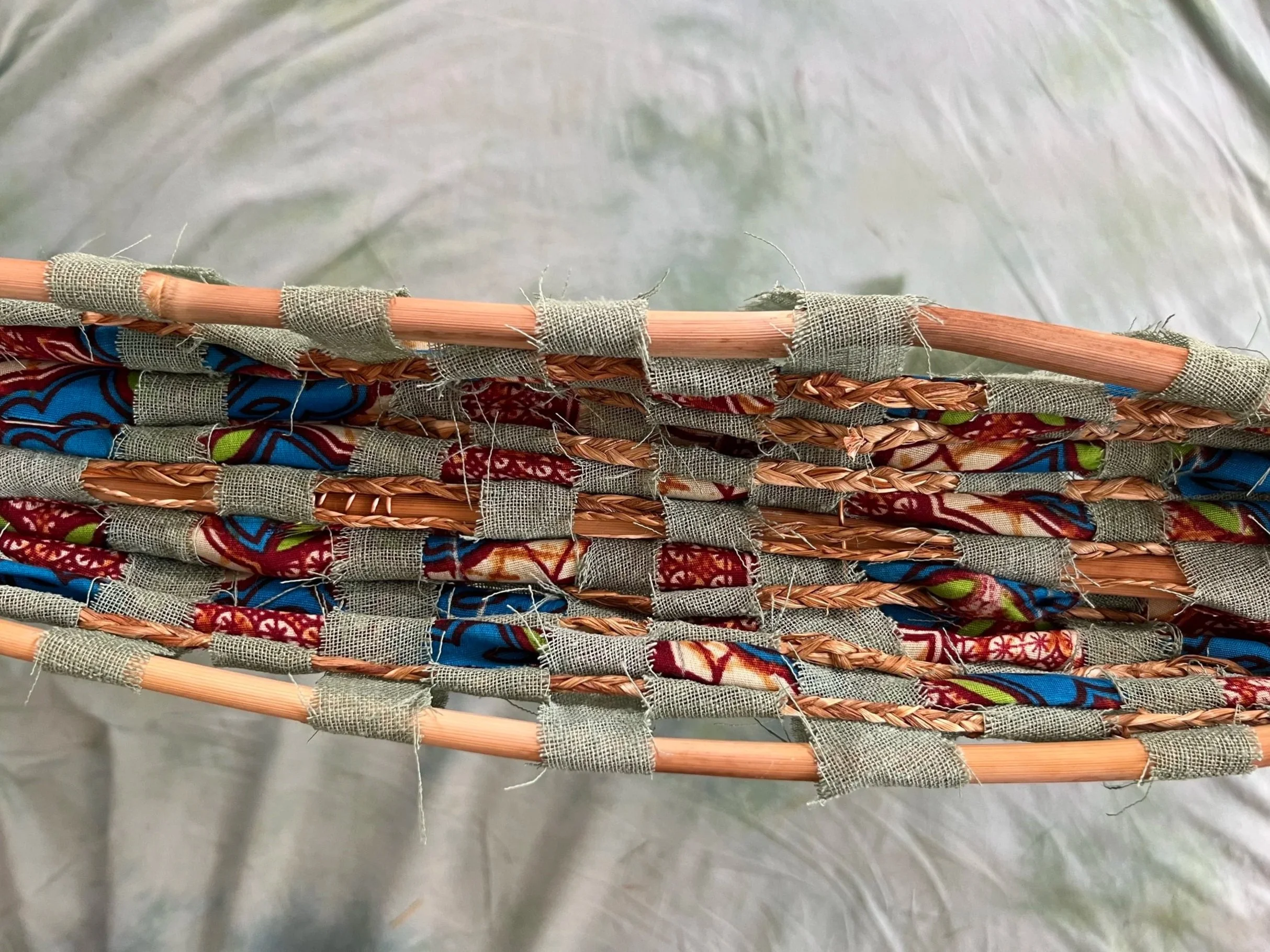 Weaving a pirogue of plant fibers and fabrics to explore the cultural influences of Louisiana maroon communities