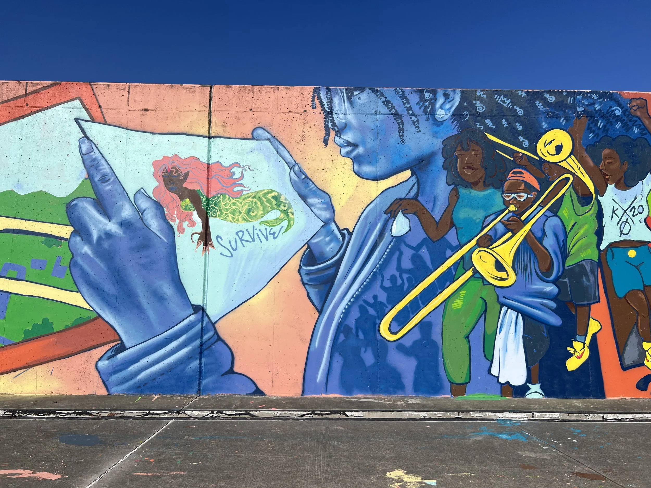 Katrina Memorial Mural on the Industrial Canal floodwall by local artist Brandan 'BMIKE' Odums and Eternal Seeds Emerging Artist Collective 