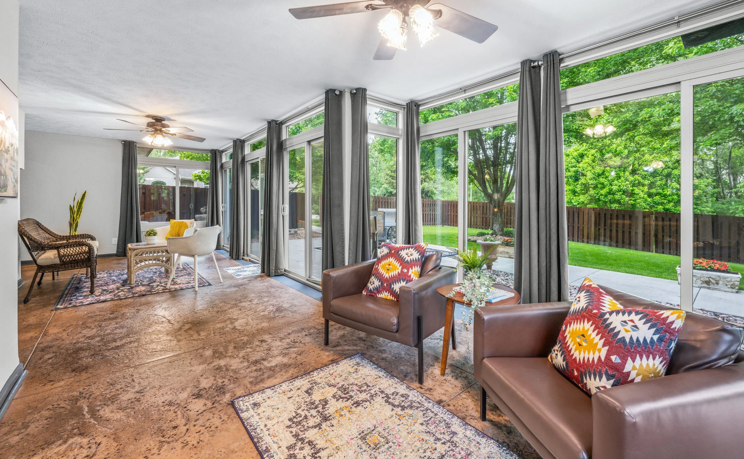 Bright sunroom interior with floor-to-ceiling windows — professional real estate photography by Gabriel Khan Media