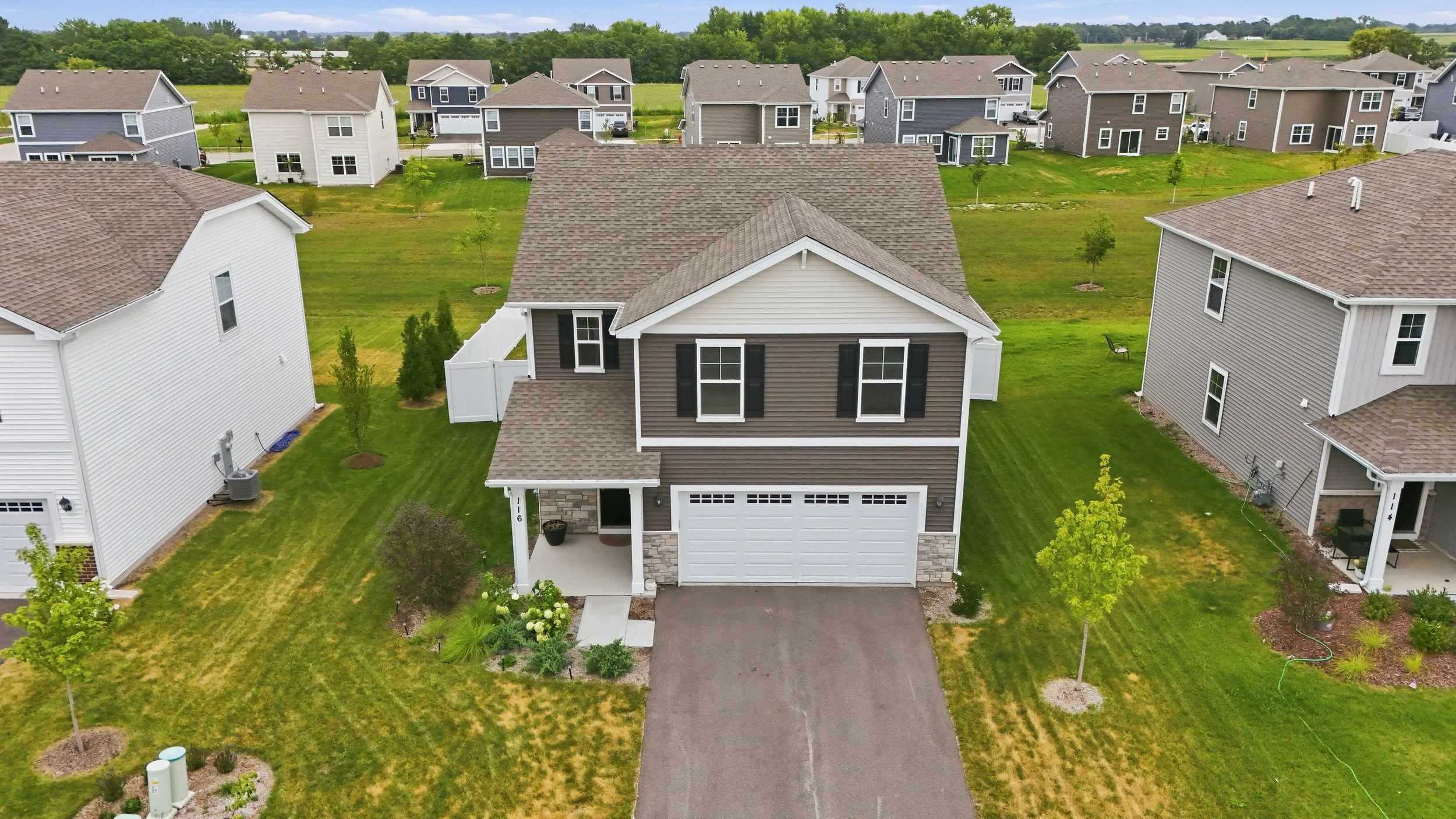 Aerial drone photo of a Hampshire, IL home and surrounding neighborhood