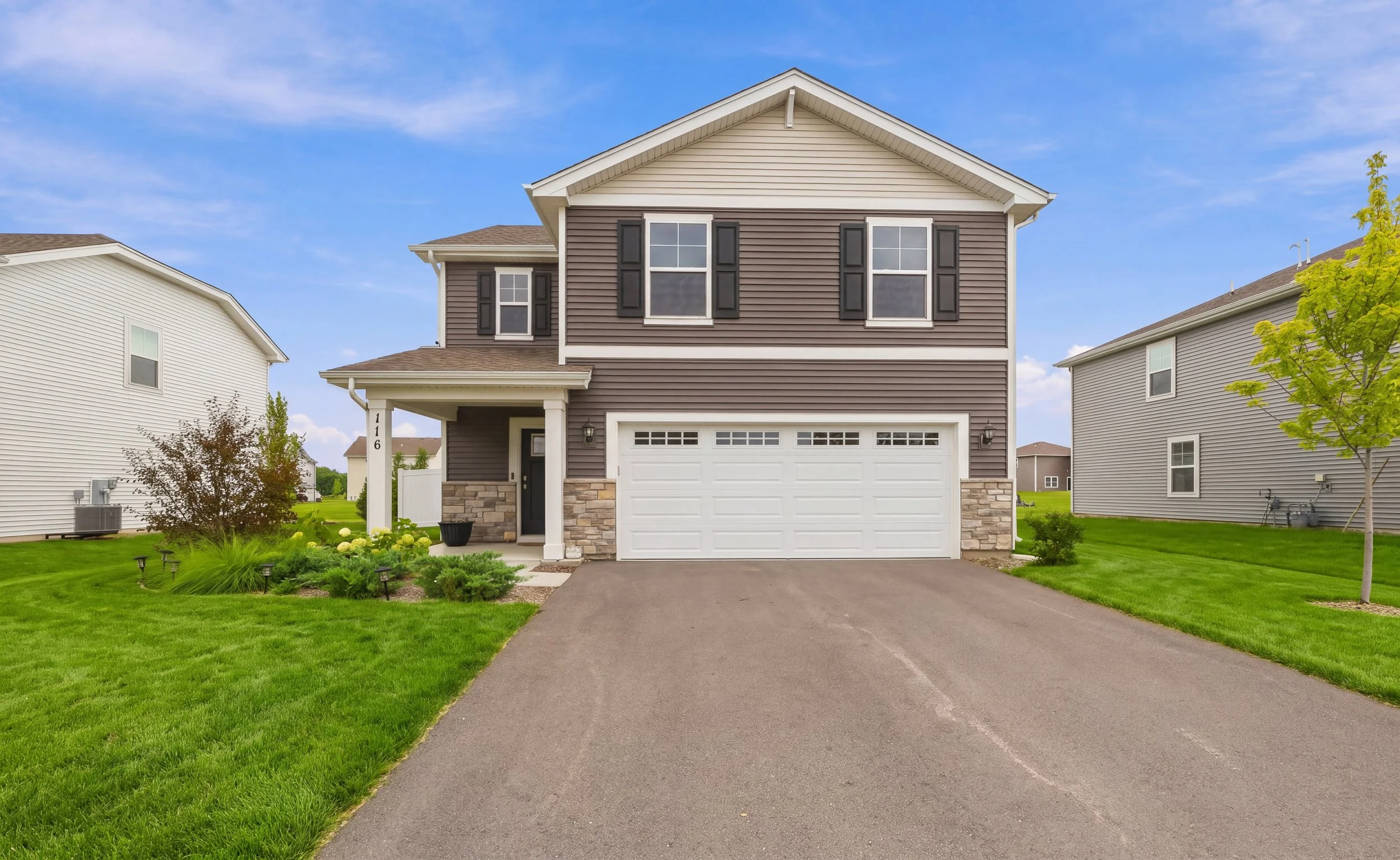 Two-story home exterior in Hampshire, IL photographed by a Fox Valley real estate photographer