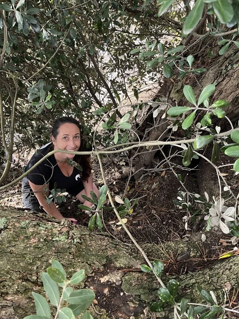 Community Programme Manager Melissa checking a burrow