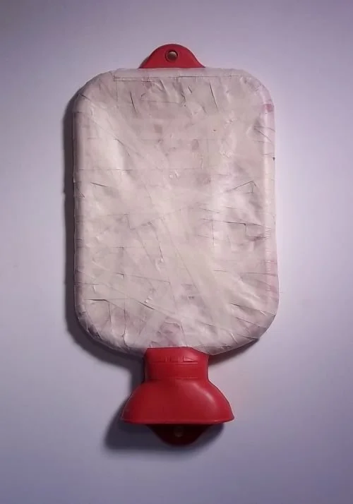 "Bandaged Moments," 2010, masking tape and leaky water bottle, 13.5 x 7.5 x 1.5