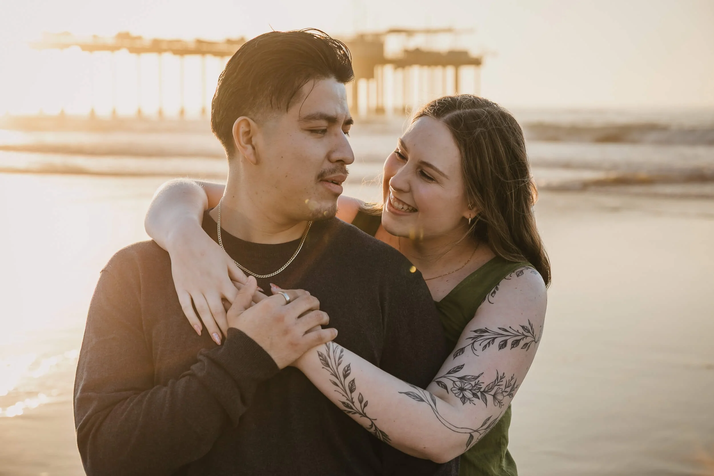 Couple interacting and looking at each other on La Jolla Shores beach during San Diego Mini Session