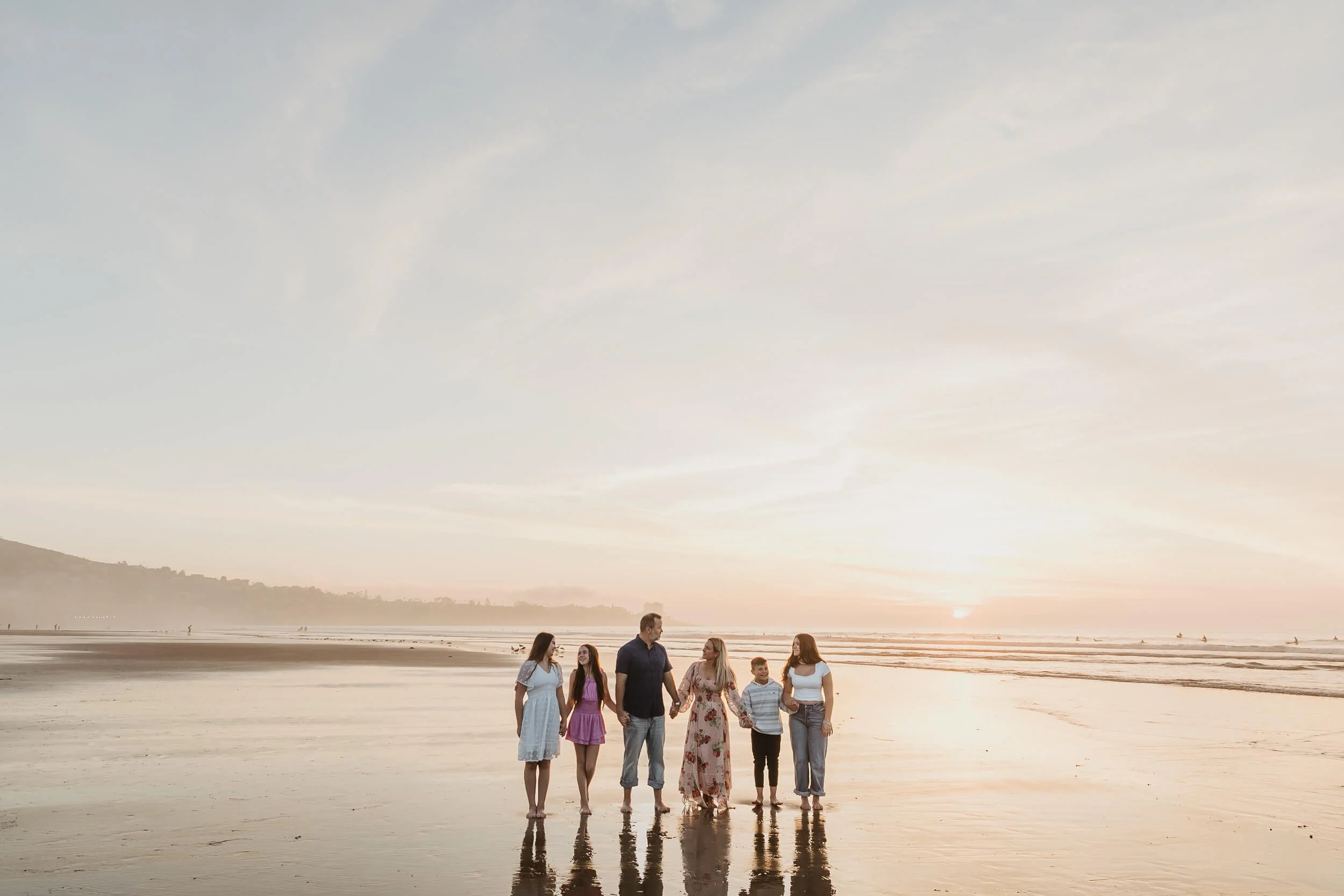 Family interacting during golden hour La Jolla Shores and Scripps Pier Family Photography in San Diego