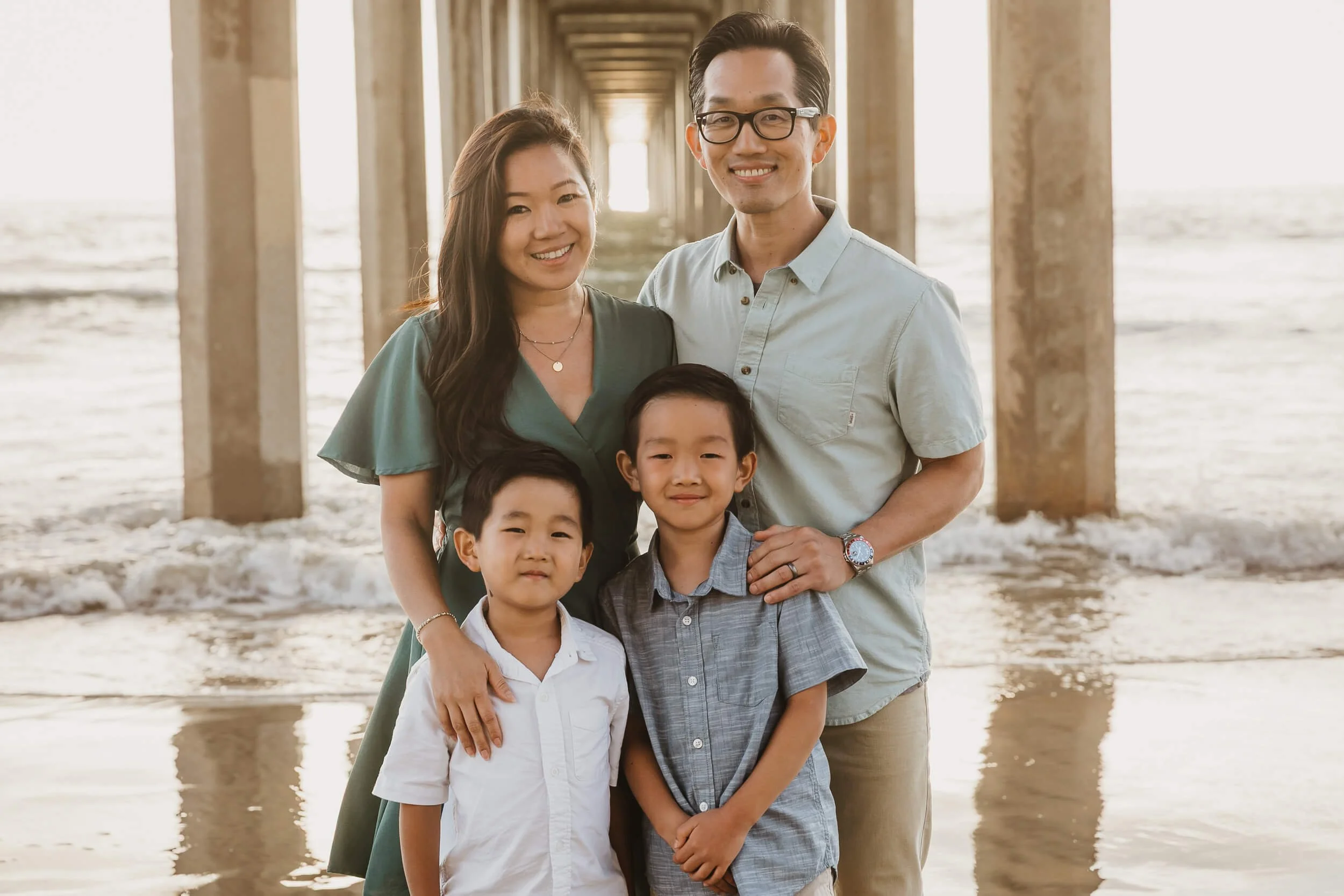 Parents and kids closeup under Scripps pier during La Jolla Family Photography Session in San Diego