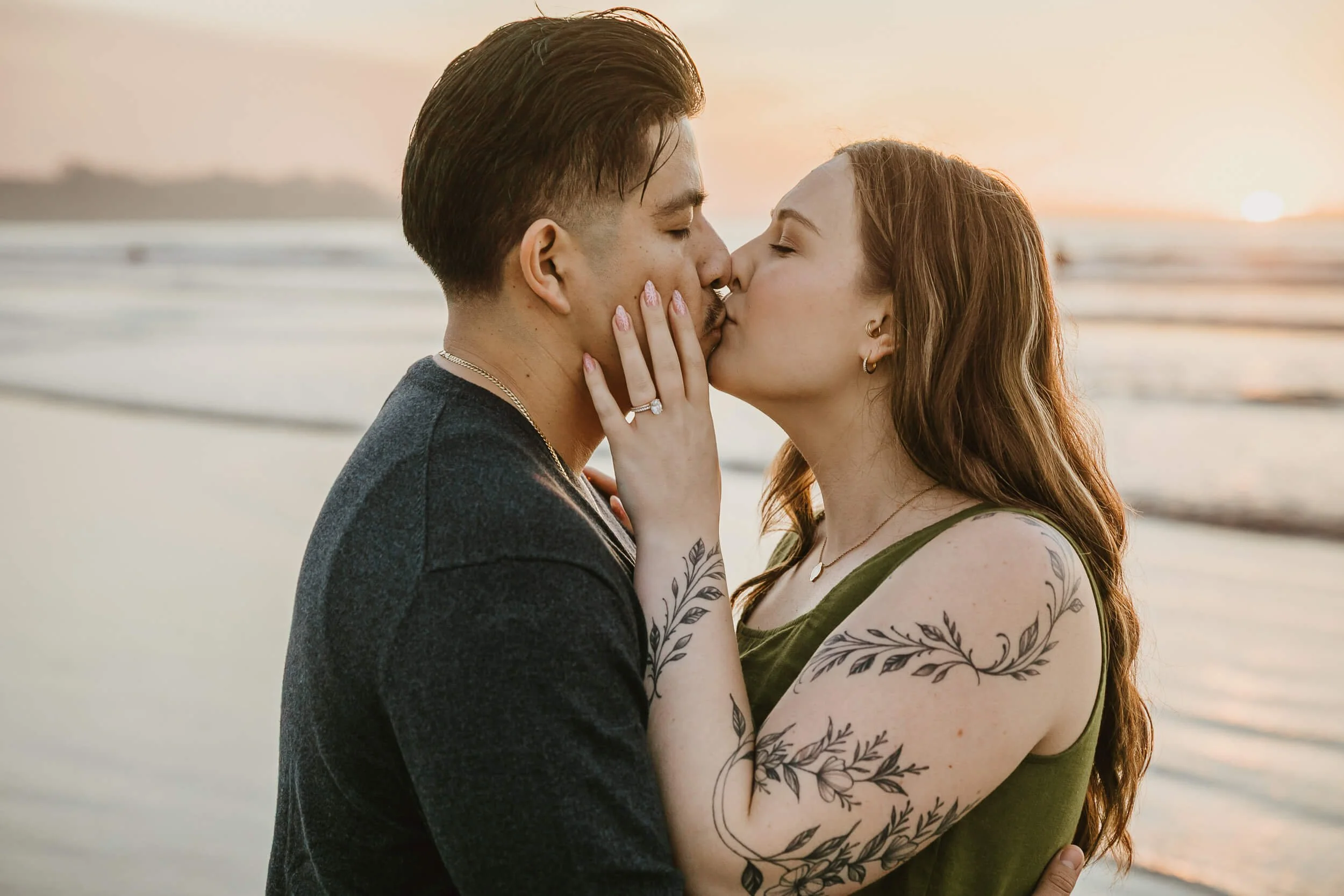 Couple kissing romantic shot during golden hour at La Jolla Shores and Scripps Pier Family Photography in San Diego