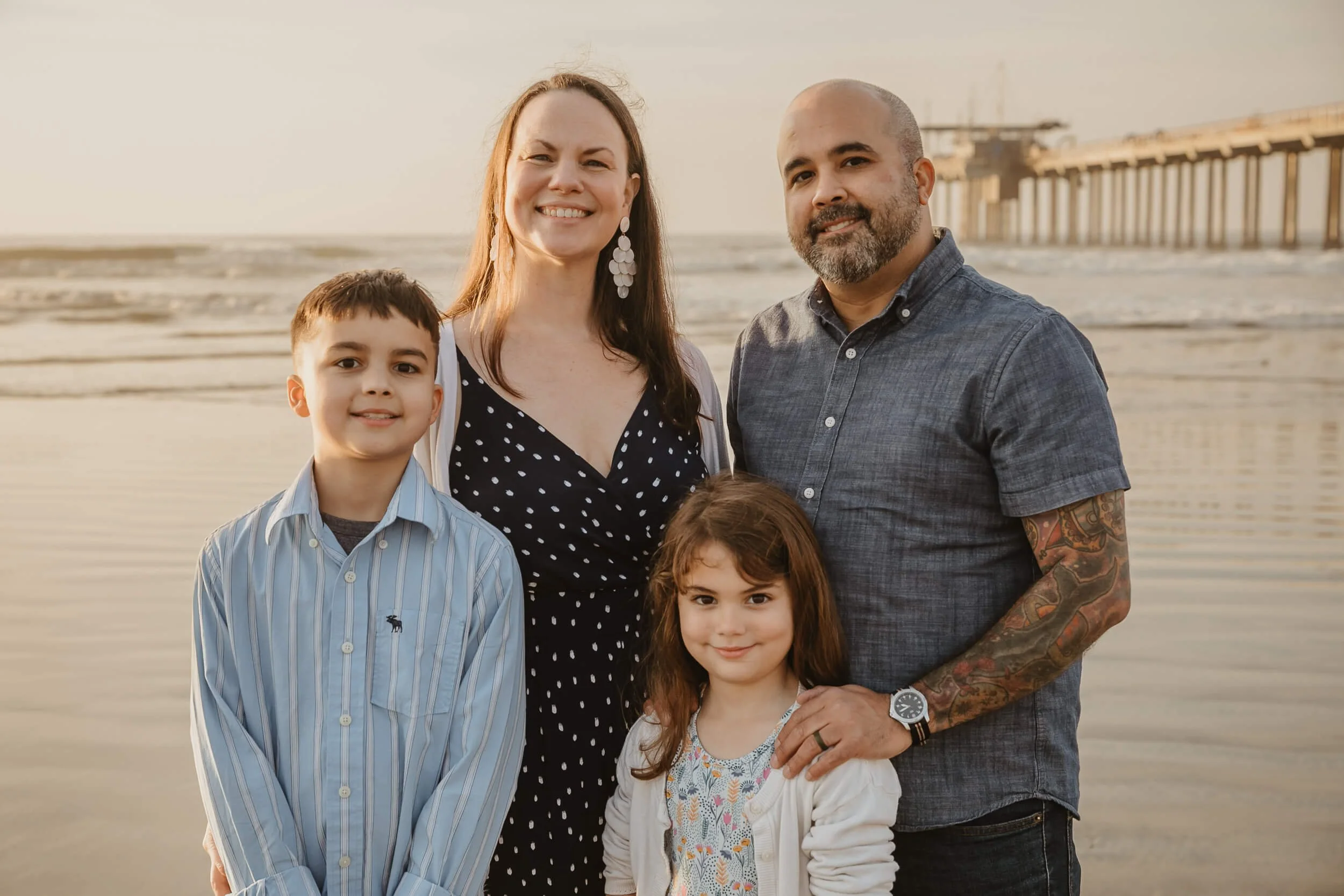 Closeup family at La Jolla Shores for San Diego mini session with Scripps Pier in background 