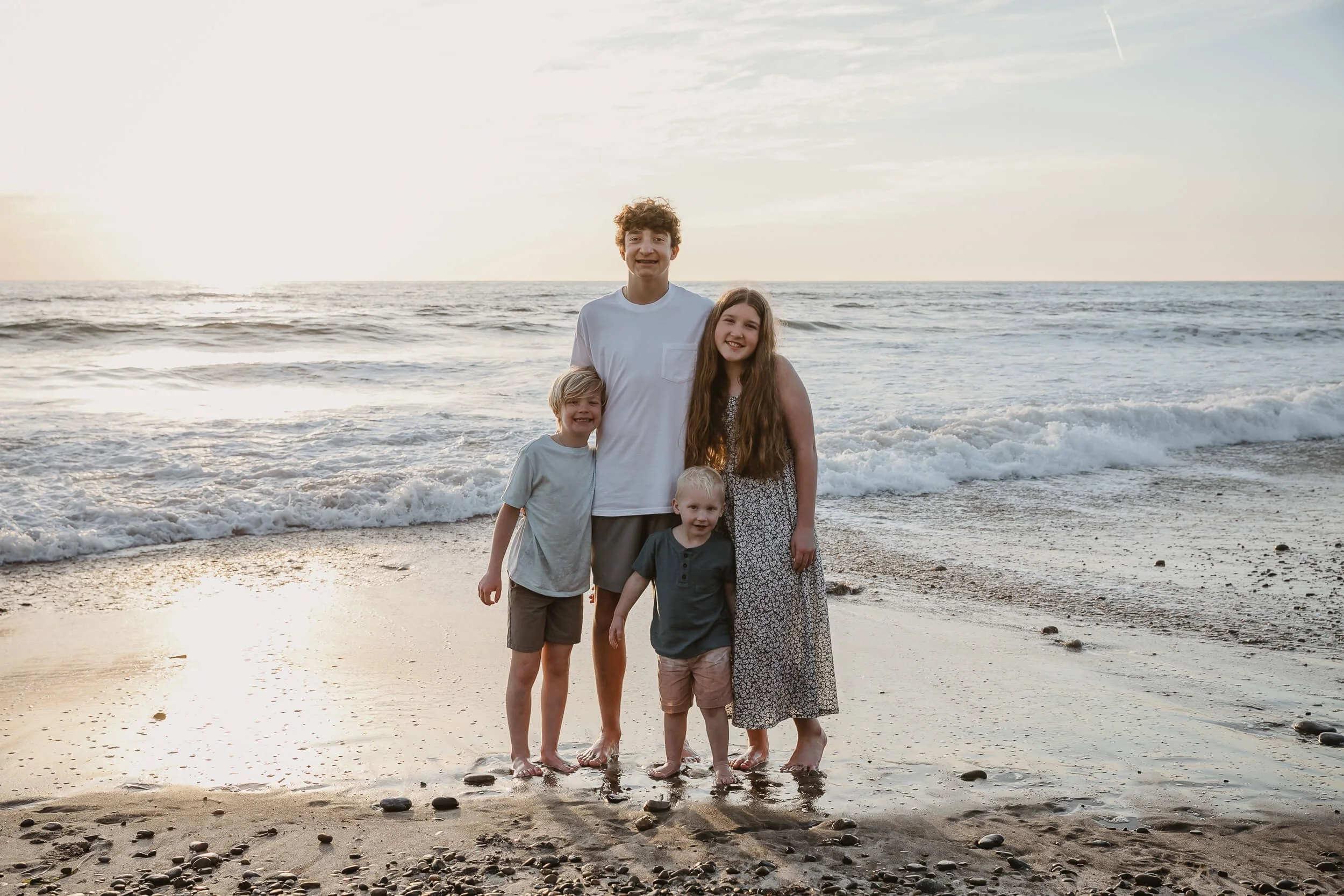 Sunset beach family portrait with children in Carlsbad, California